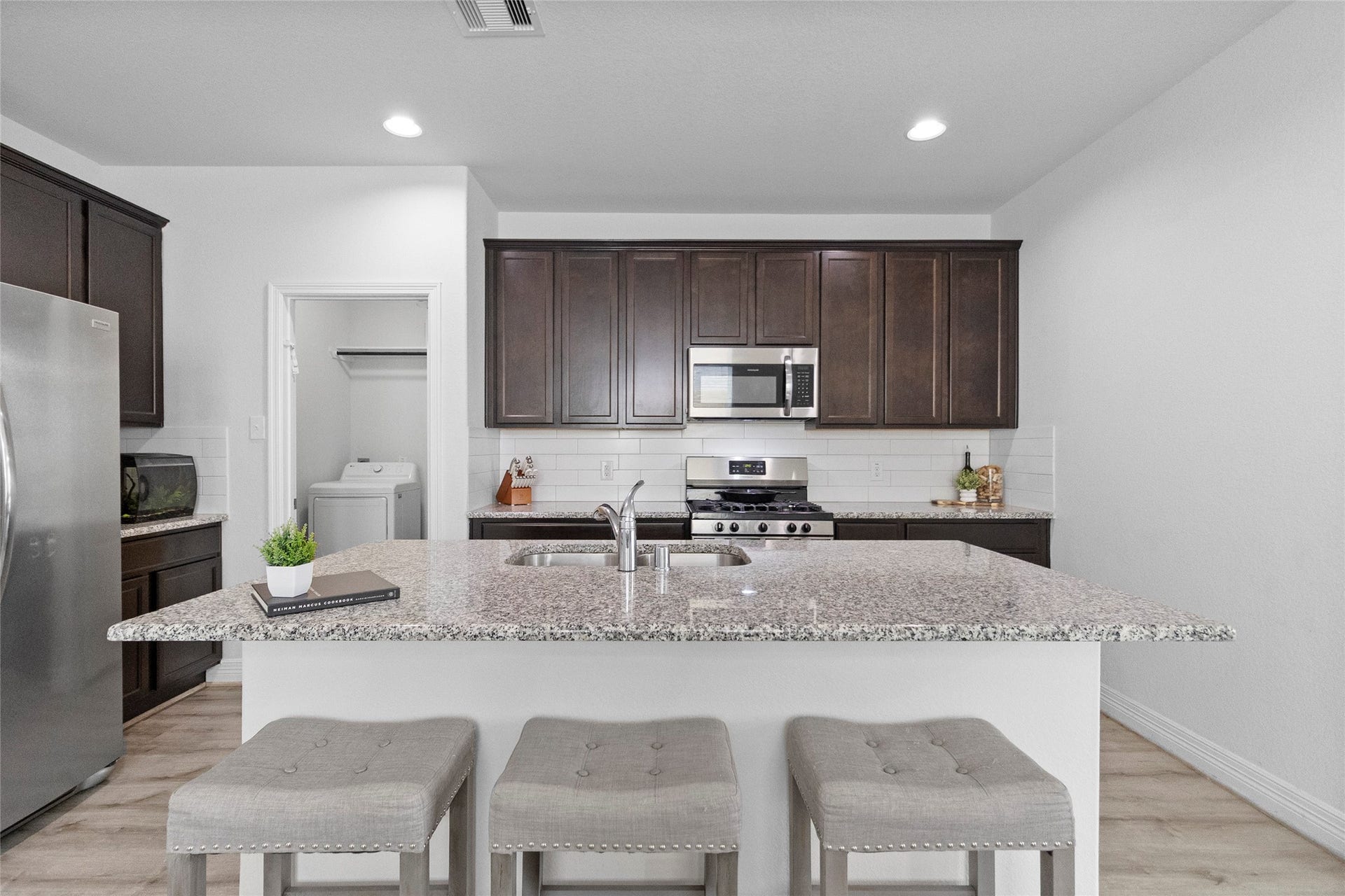 From the kitchen, you can stay connected to the conversation while preparing meals, with the open layout flowing naturally into the surrounding living spaces.