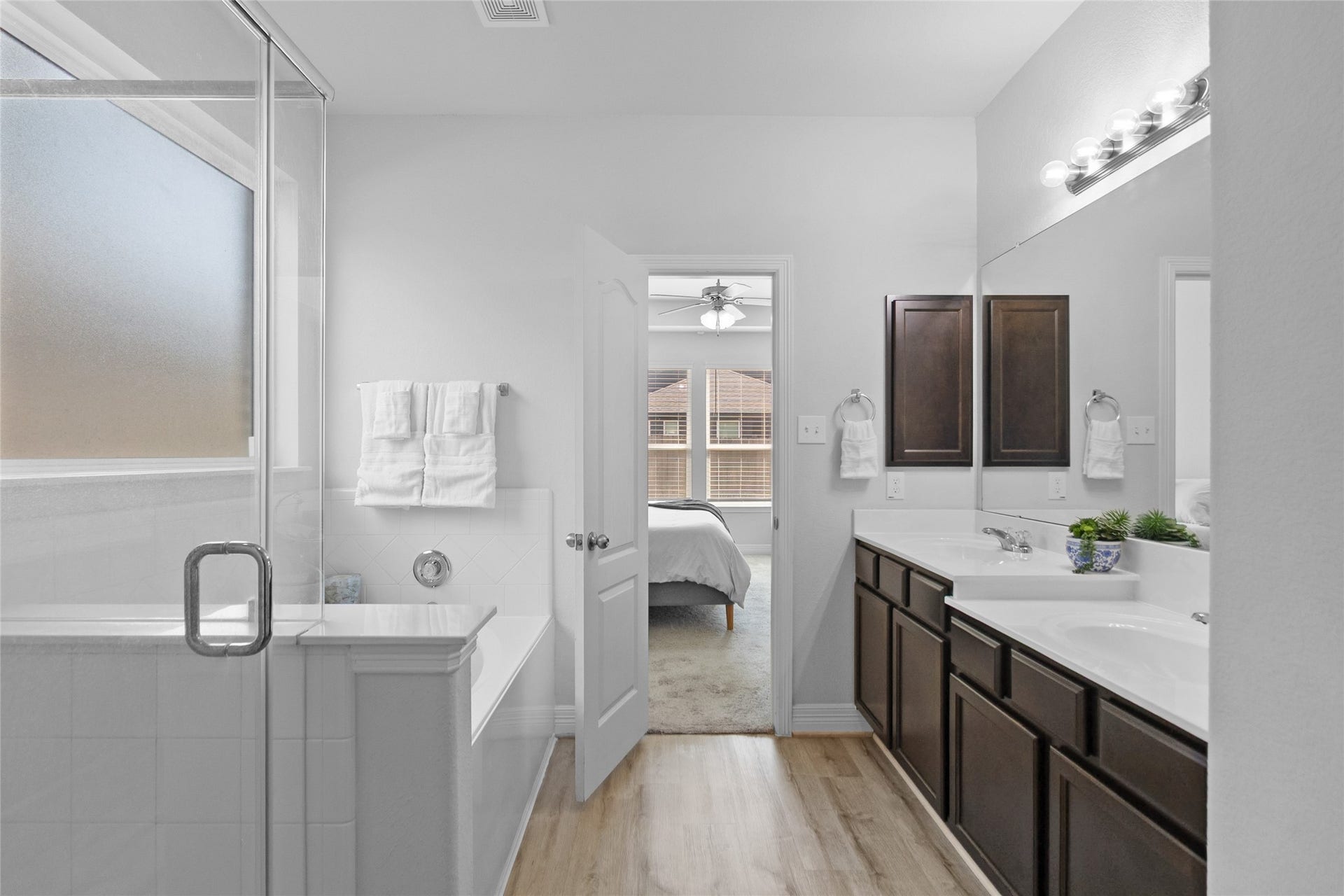 Getting ready for the day feels effortless in this bright bathroom, with a spacious vanity, generous counter space, and a walk-in shower.