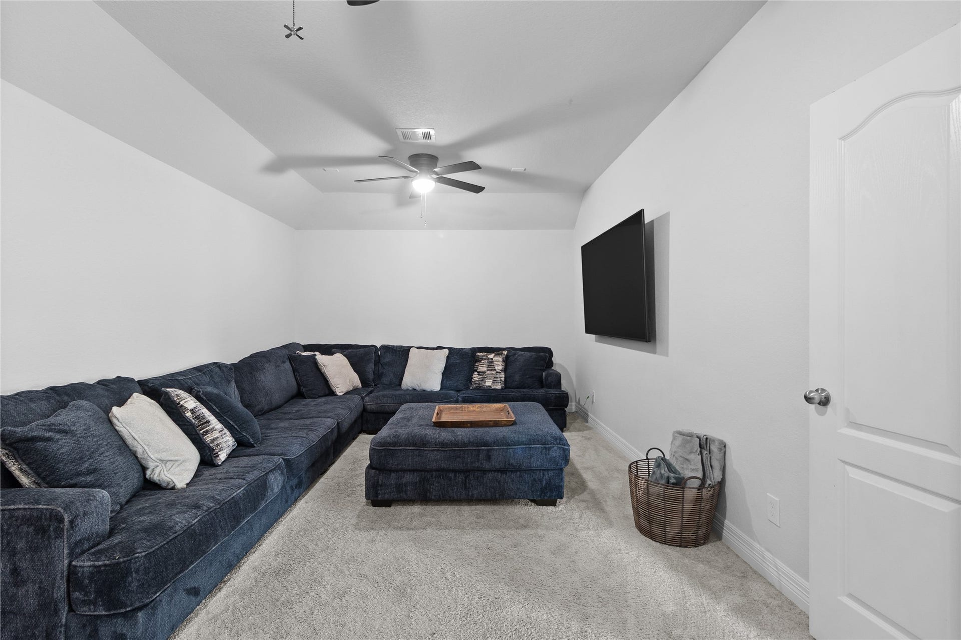 Movie nights feel right at home in this cozy upstairs retreat, with plenty of space to stretch out and settle in.