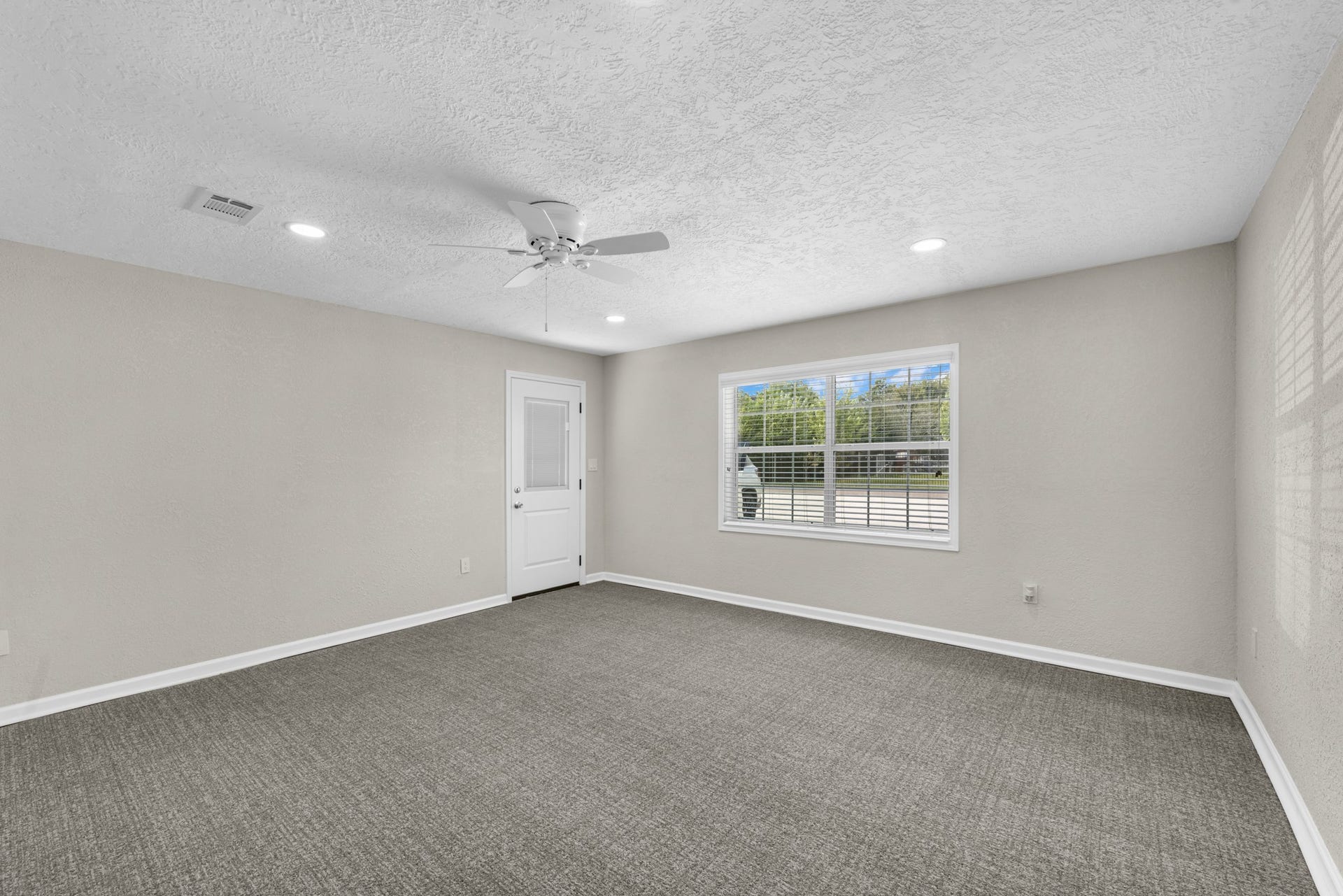 17435 Wells Drive, #CR115, Pearland, TX 77584 Next, the oversized bedroom features a large window and direct exterior access.