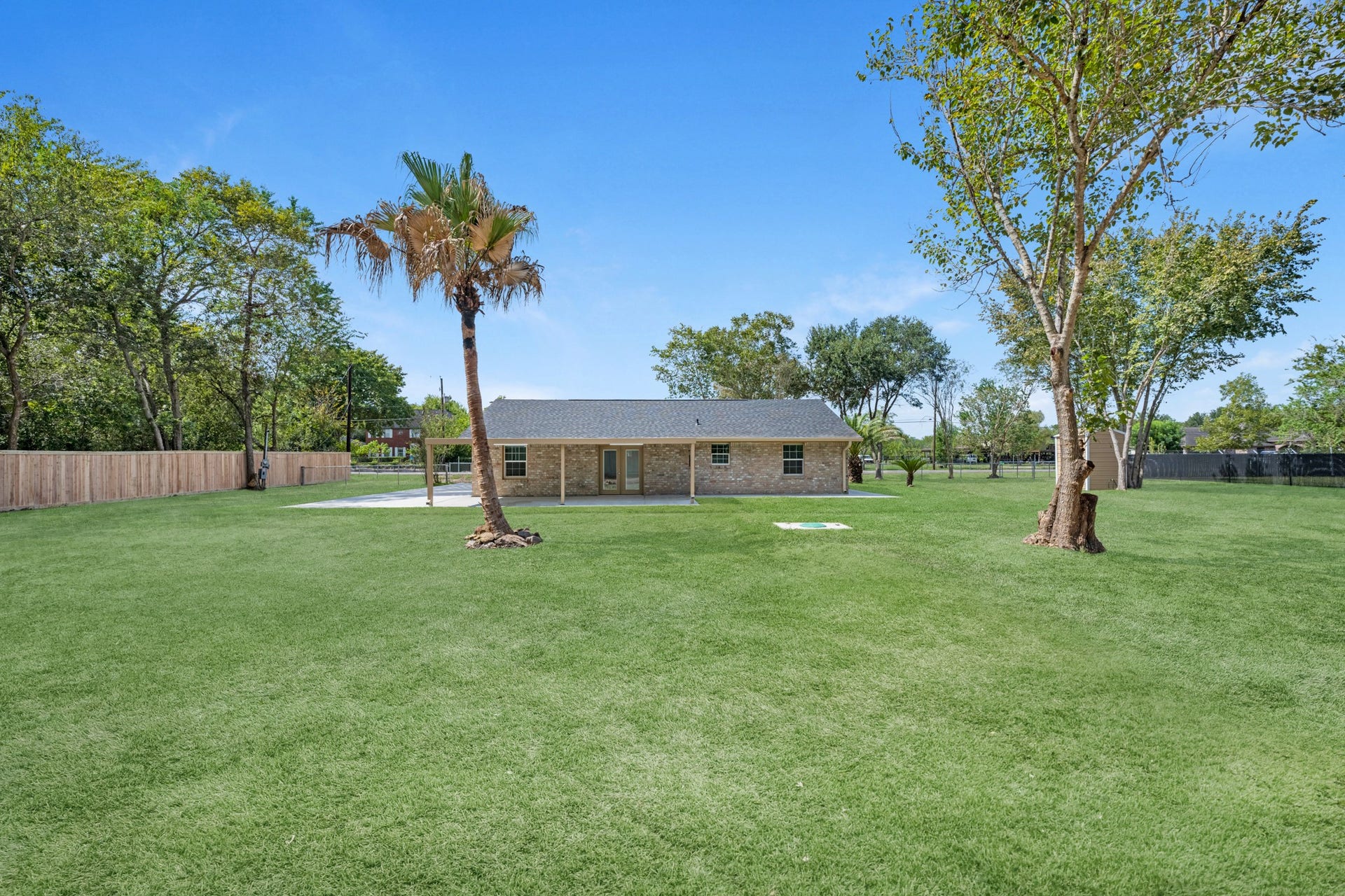 17435 Wells Drive, #CR115, Pearland, TX 77584 The oversized backyard features large mature trees, ready for your imagination.