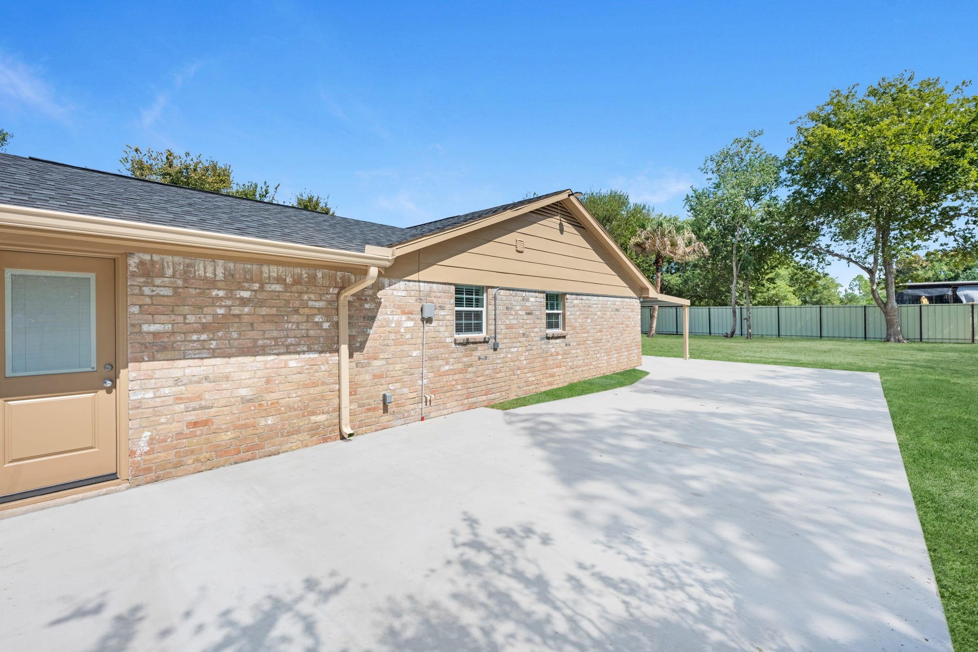 17435 Wells Drive, #CR115, Pearland, TX 77584 Just beyond, a large patio provides additional outdoor space.