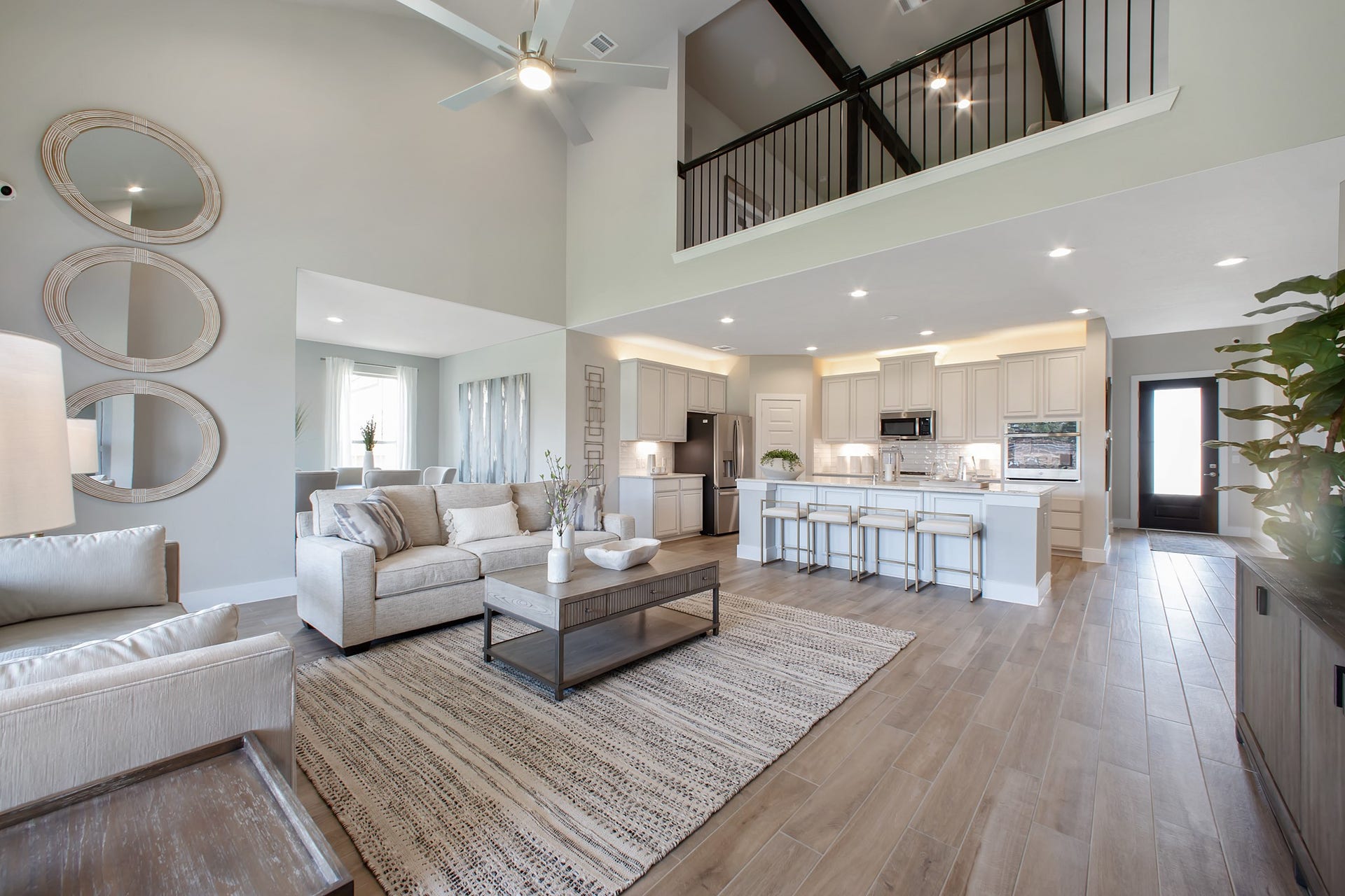 22122 Cortona Creek Lane, Hockley, TX 77447 Gather the family and guests together in your lovely living room! Featuring soaring high ceilings, recessed lighting, ceiling fan, custom paint, gorgeous floors, and large windows that provide plenty of natural lighting throughout the day.