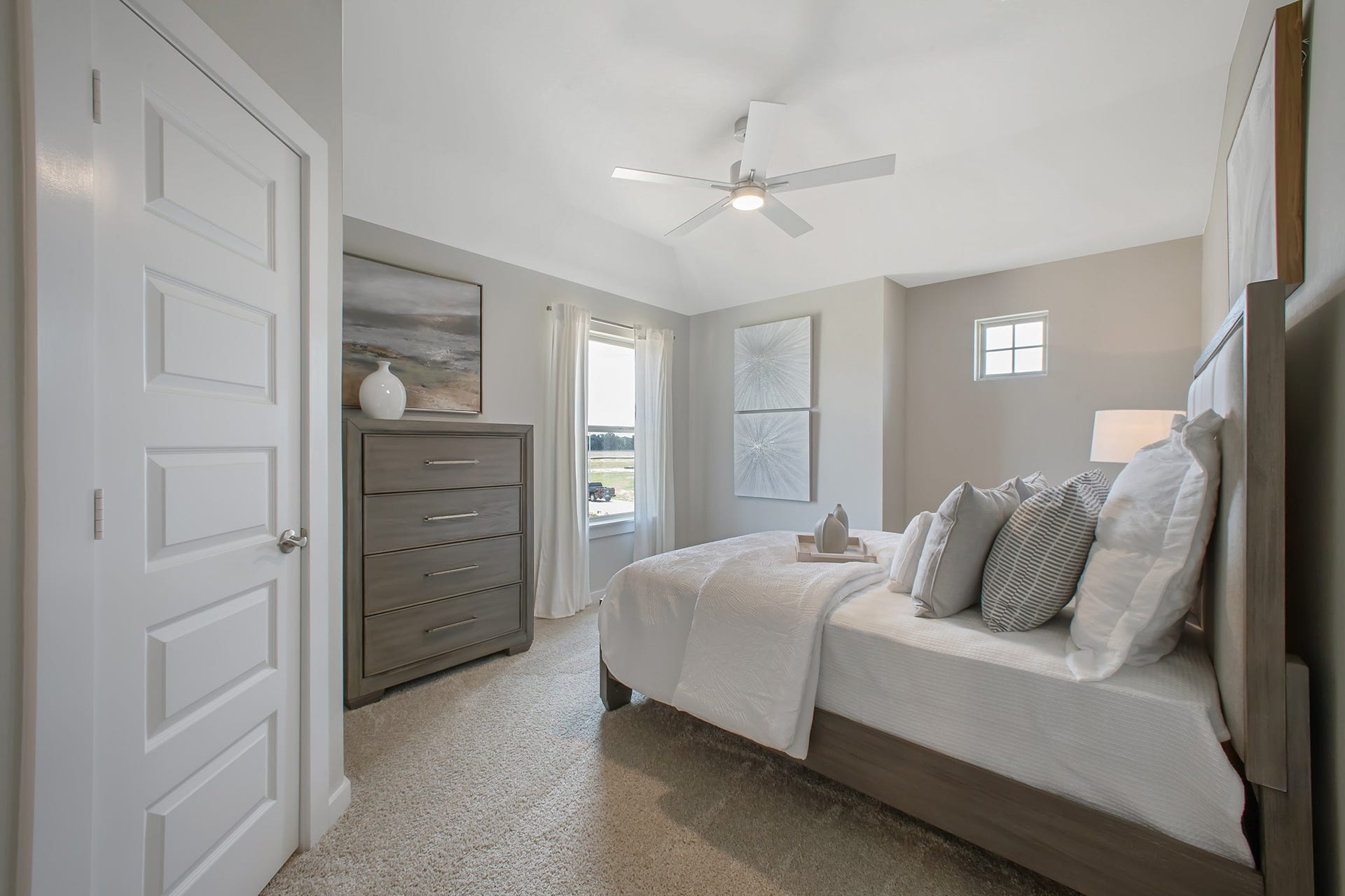 22122 Cortona Creek Lane, Hockley, TX 77447 Generously sized secondary bedrooms featuring spacious closets, soft and inviting carpeting underfoot, large windows allowing plenty of natural light, and the added touch of privacy blinds for your personal retreat.