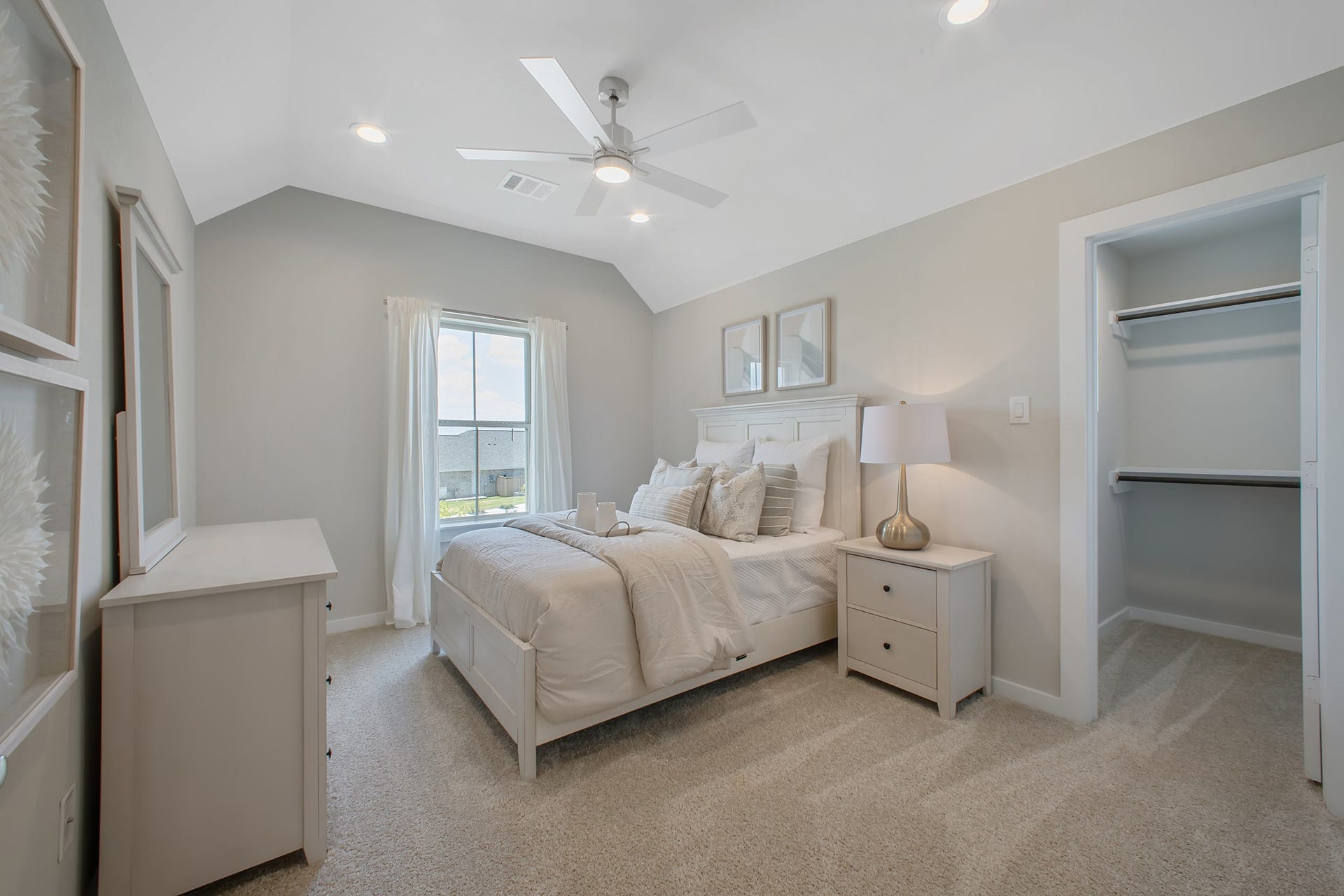 22122 Cortona Creek Lane, Hockley, TX 77447 Generously sized secondary bedrooms featuring spacious closets, soft and inviting carpeting underfoot, large windows allowing plenty of natural light, and the added touch of privacy blinds for your personal retreat.