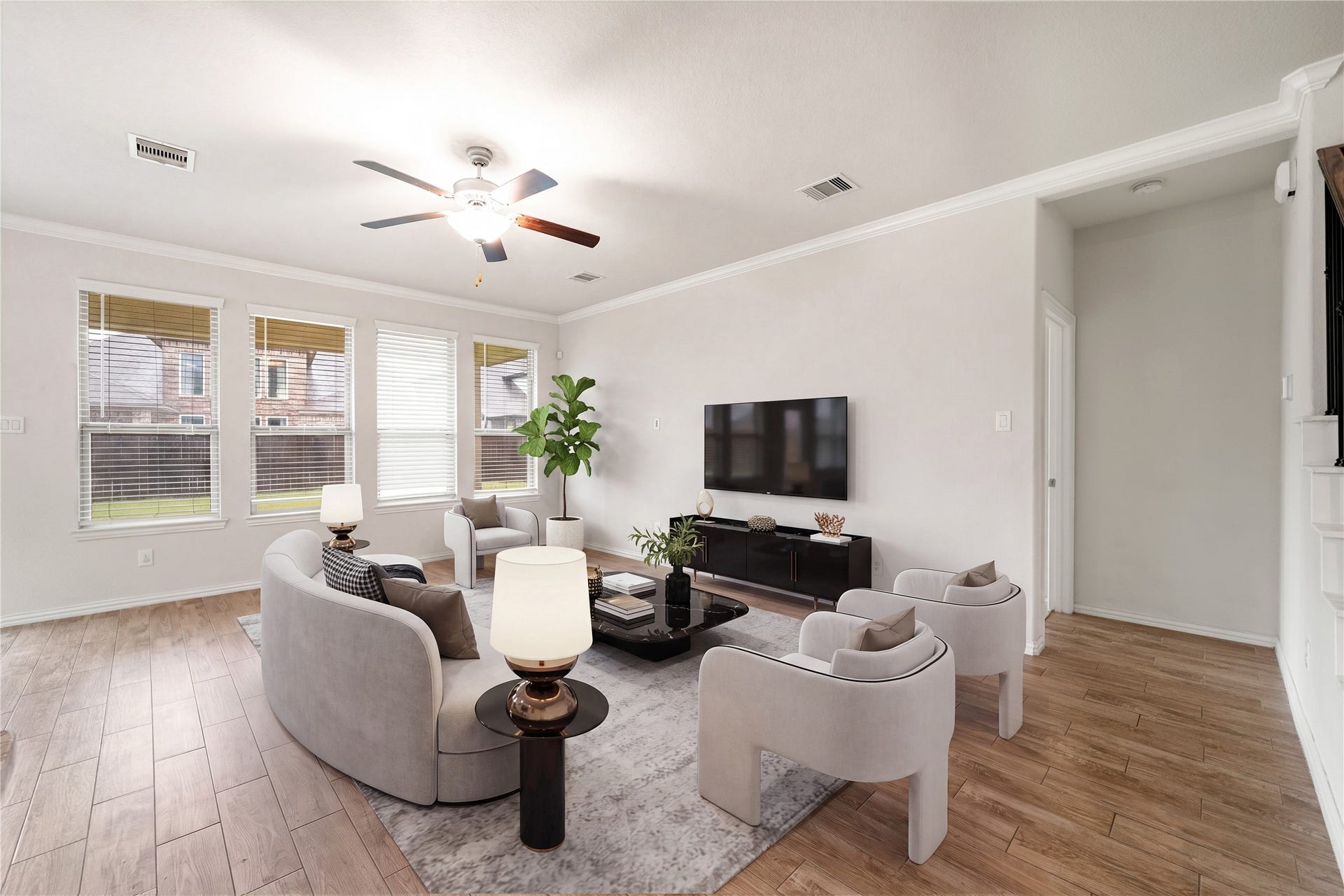 2418 Green Kale Drive, Richmond, TX 77406 Spacious and full of natural light, the living room offers crown molding, a ceiling fan, beautiful wood flooring, and large windows overlooking the backyardan inviting space to relax and unwind! *Virtually Staged
