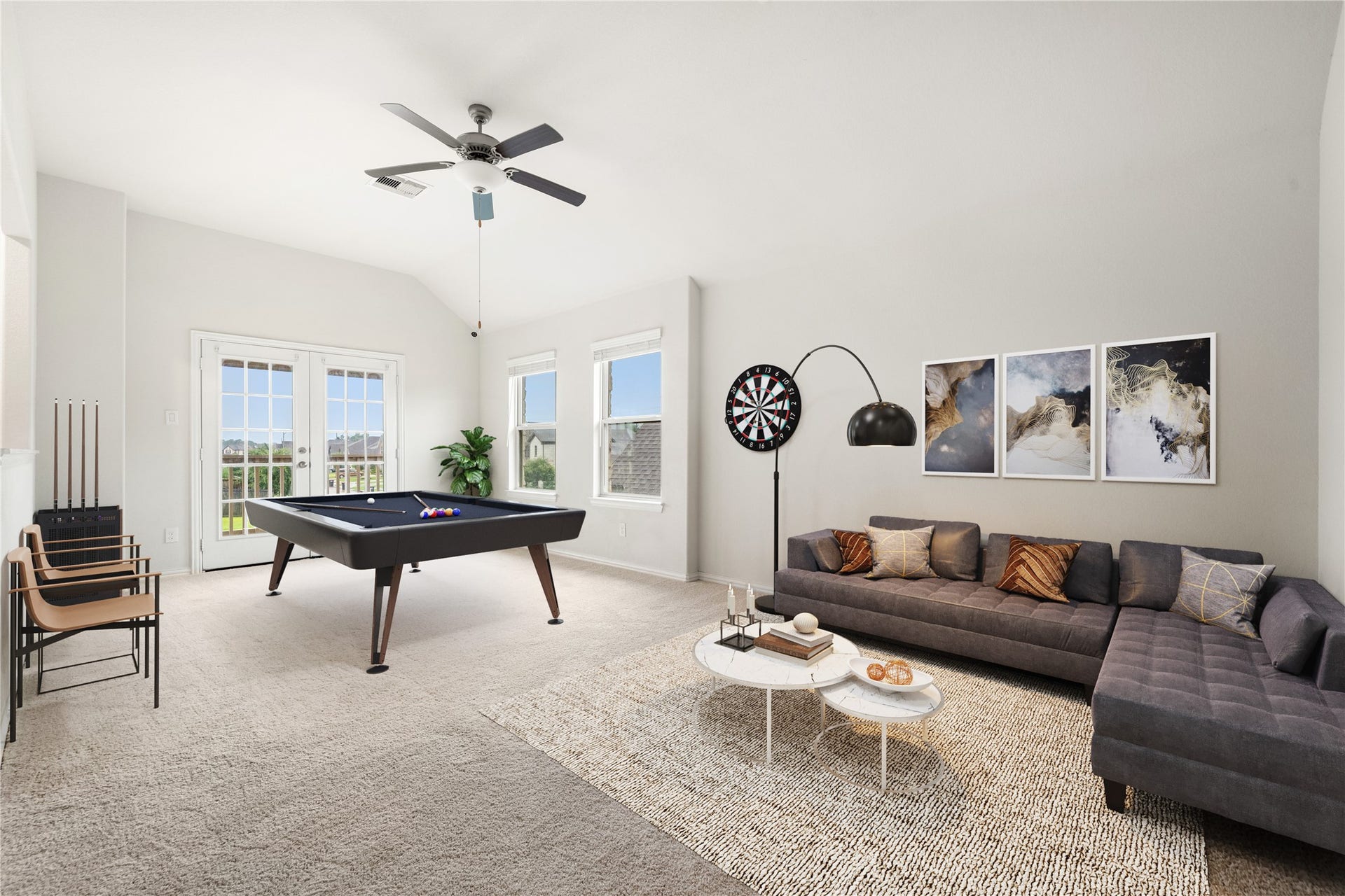 2418 Green Kale Drive, Richmond, TX 77406 This expansive upstairs game room is built for fun and entertaining, featuring soaring vaulted ceilings, a ceiling fan, plush carpeting, and French doors leading out to a private balcony! *Virtually Staged