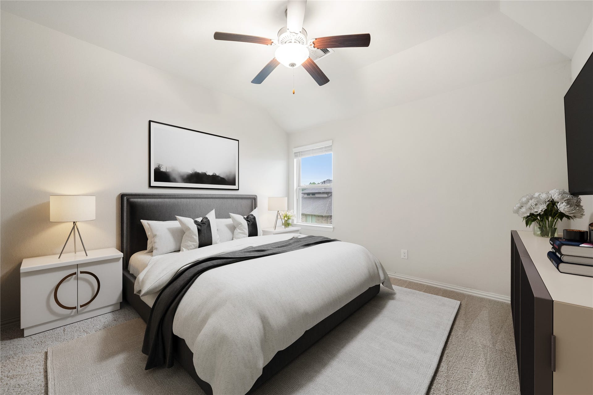 2418 Green Kale Drive, Richmond, TX 77406 Bright and inviting, this secondary bedroom offers a vaulted ceiling, ceiling fan, carpeting throughout, and a window overlooking the neighborhood, perfect for family, guests, or a home office! *Virtually Staged