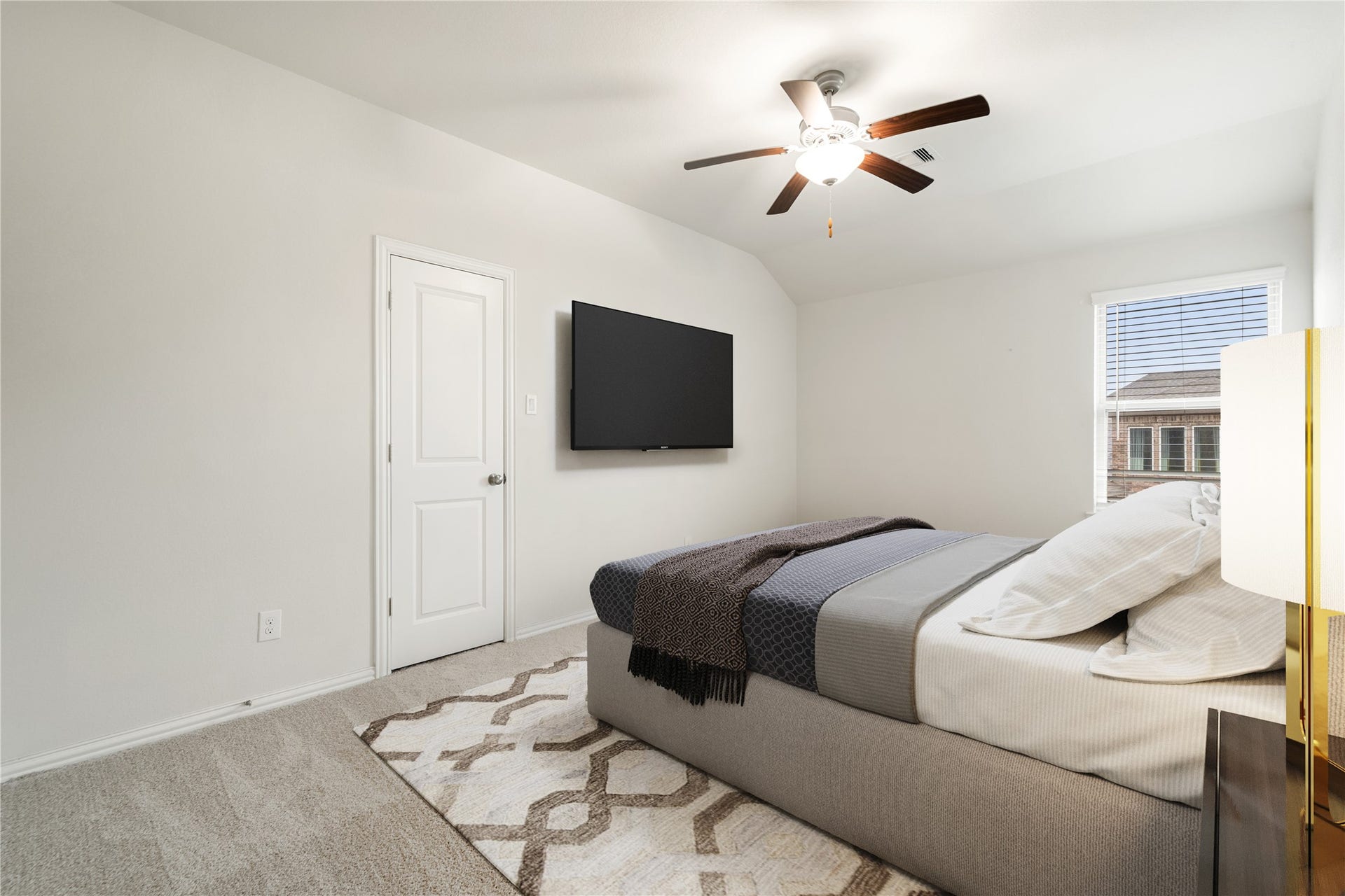 2418 Green Kale Drive, Richmond, TX 77406 A comfortable and versatile secondary bedroom featuring a ceiling fan, soft carpeting, vaulted ceiling, and a window with plenty of natural light! *Virtually Staged