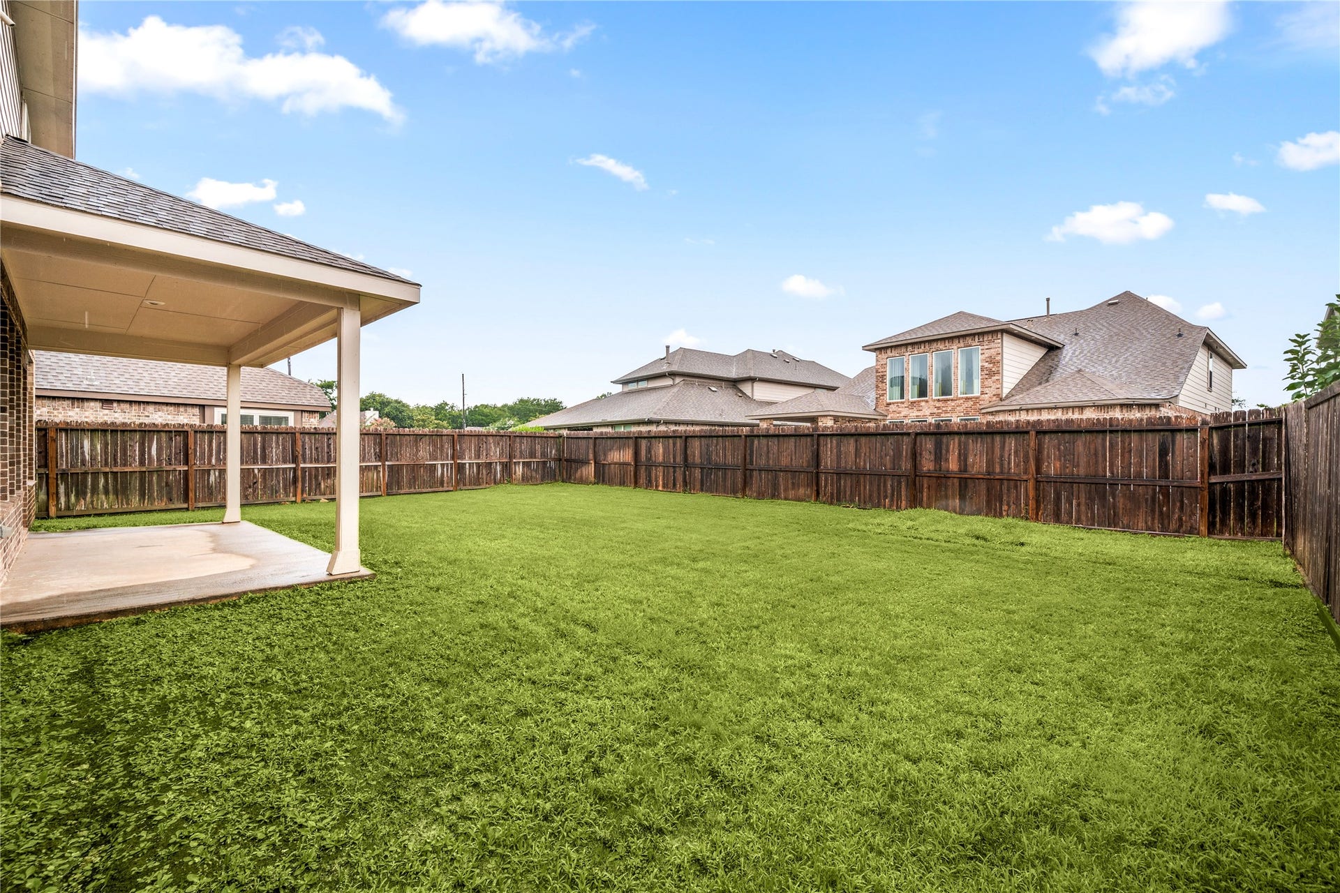 2418 Green Kale Drive, Richmond, TX 77406 Plenty of room to play, relax, and entertain! The spacious fenced backyard features a covered patio and a sprawling lawn with no shortage of space to make it your own.