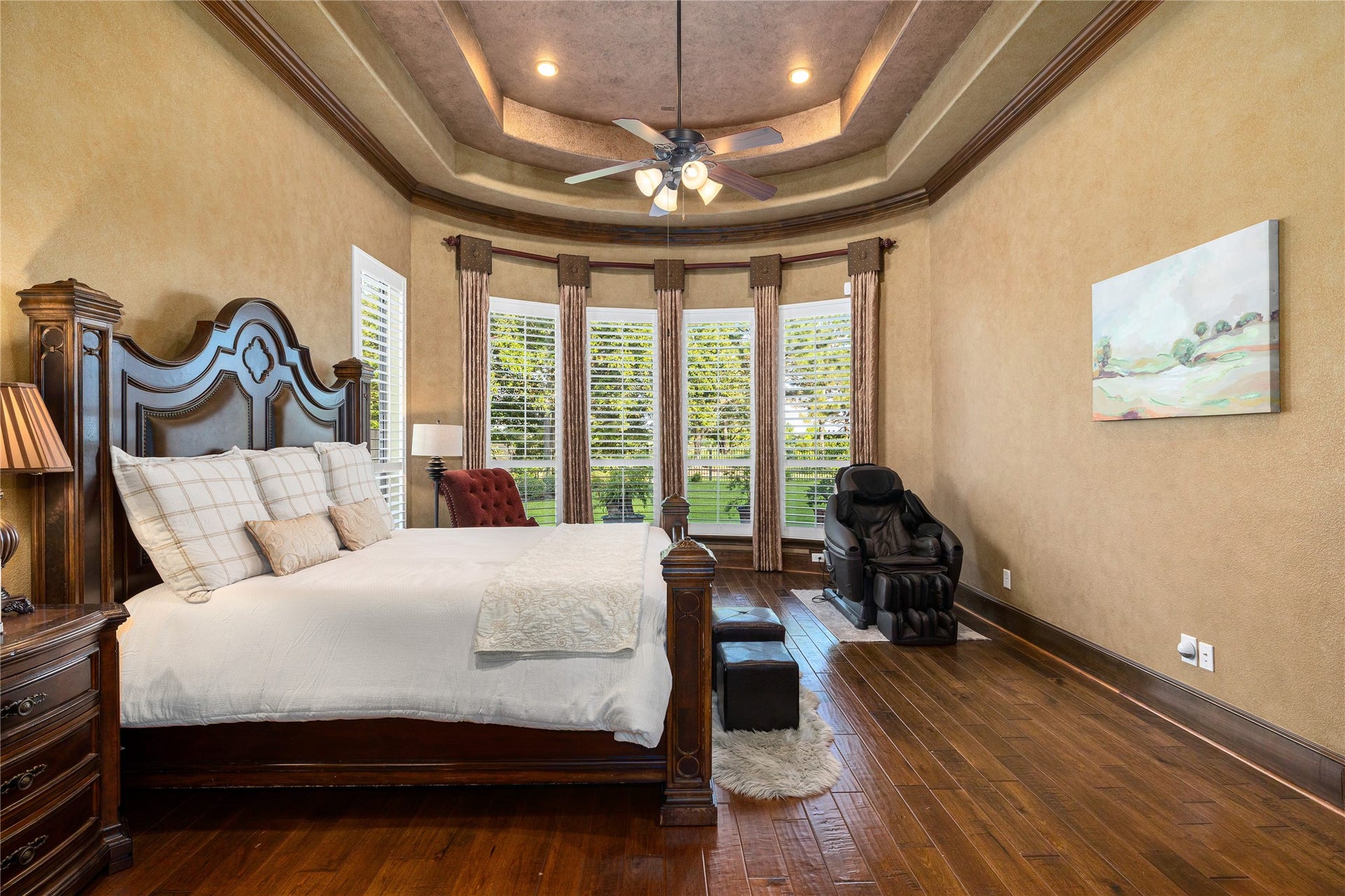 27711 Charter Lake Lane, Katy, TX 77494 Luxurious owner's retreat featuring elegant architectural details and tranquil waterfront views.