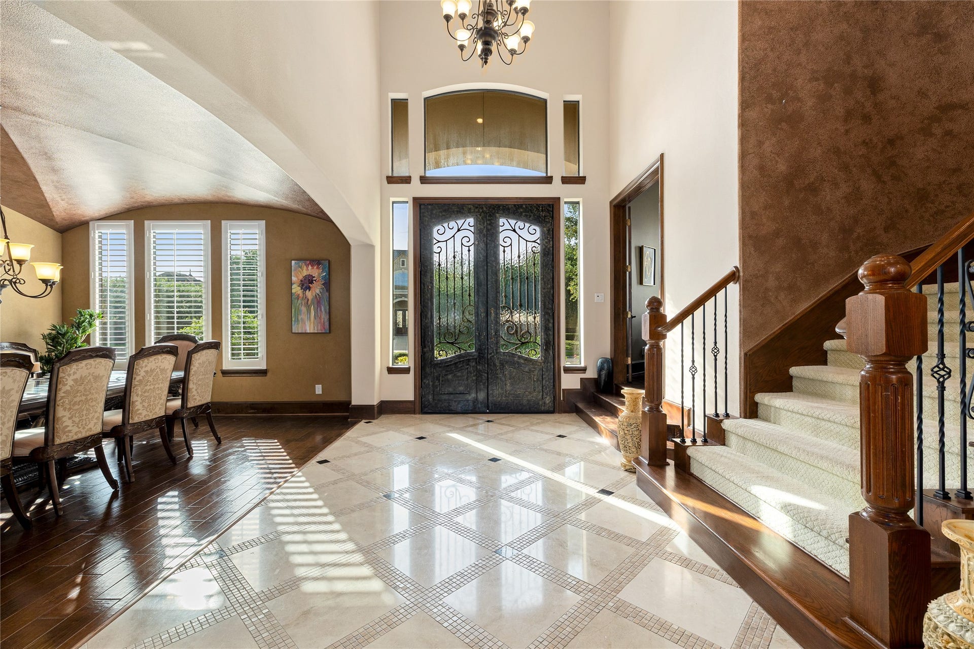 27711 Charter Lake Lane, Katy, TX 77494 A GRAND FOYER welcomes you with soaring ceilings and two impressive staircases, including a stunning spiral staircase