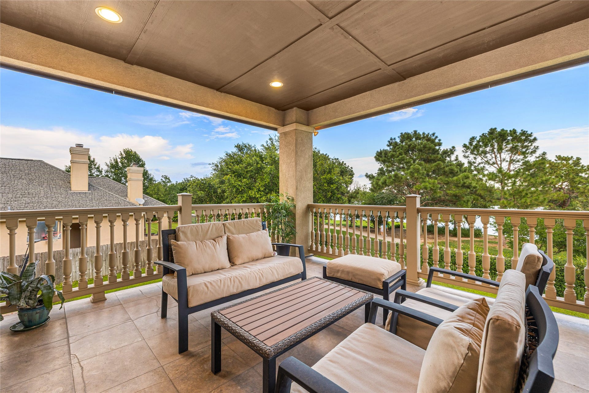 27711 Charter Lake Lane, Katy, TX 77494 Second-floor balcony provides the perfect setting to unwind and enjoy sunset views over the water