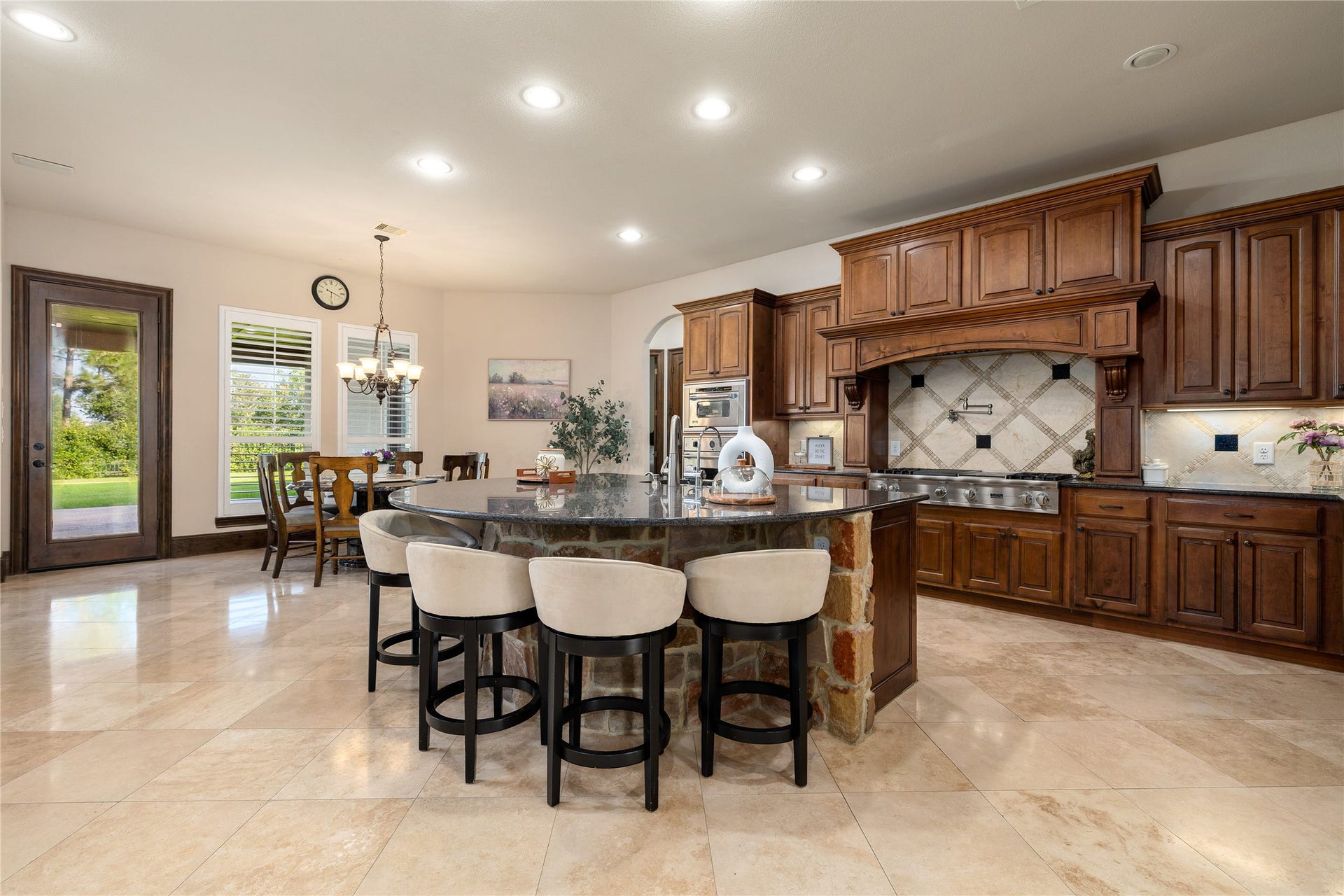 27711 Charter Lake Lane, Katy, TX 77494 Gourmet kitchen featuring premium built-in appliances, custom cabinetry, oversized island, and abundant prep space.