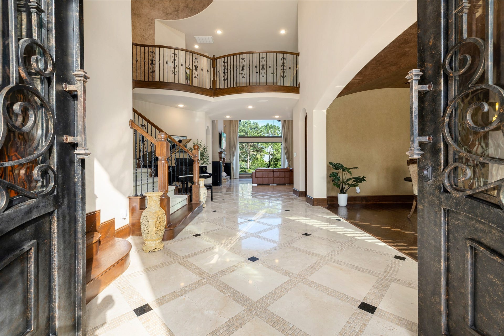 27711 Charter Lake Lane, Katy, TX 77494 A GRAND FOYER welcomes you with soaring ceilings and a stunning spiral staircase