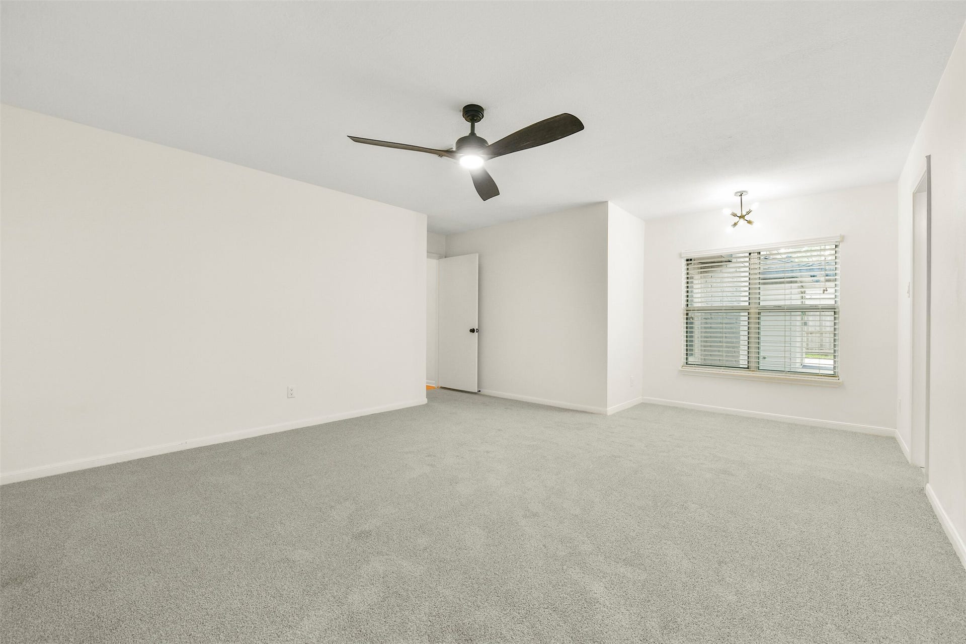 Primary bedroom with view of seating nook....