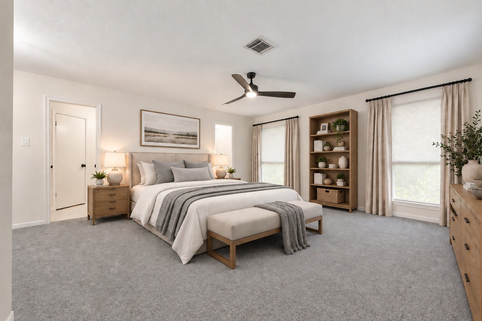 This is the primary bedroom with the bed facing the entry area. It features 2 windows plus another at the seating area. There's an updated ceiling fan and fresh carpeting throughout all bedrooms. Virtually staged.