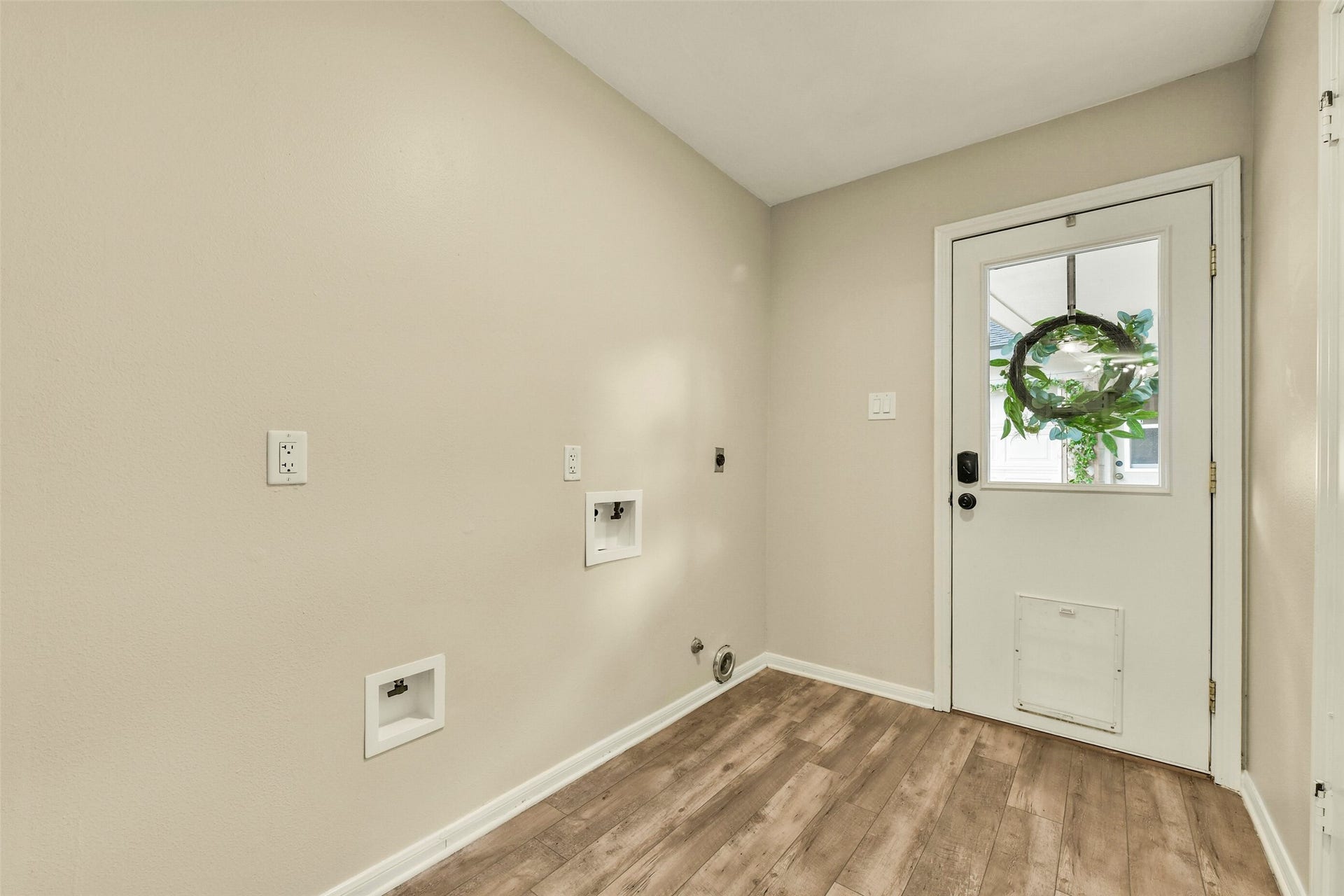 The laundry room is conveniently located in house and has plenty of room...