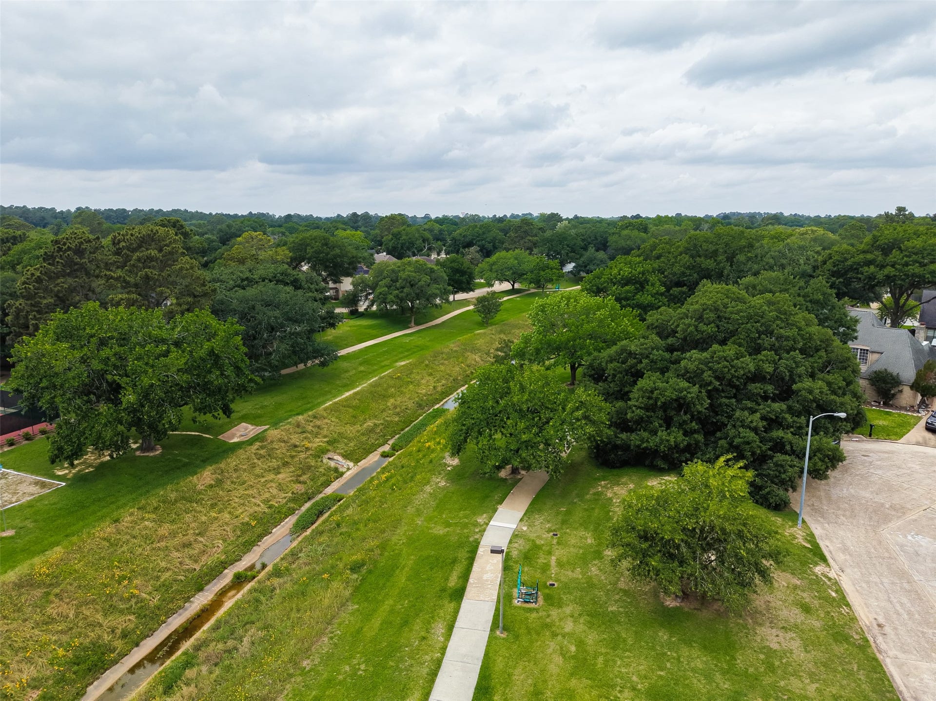 The community walking trail is appx 1.75 miles. No need to go to a park to walk.... it's all here within reach!