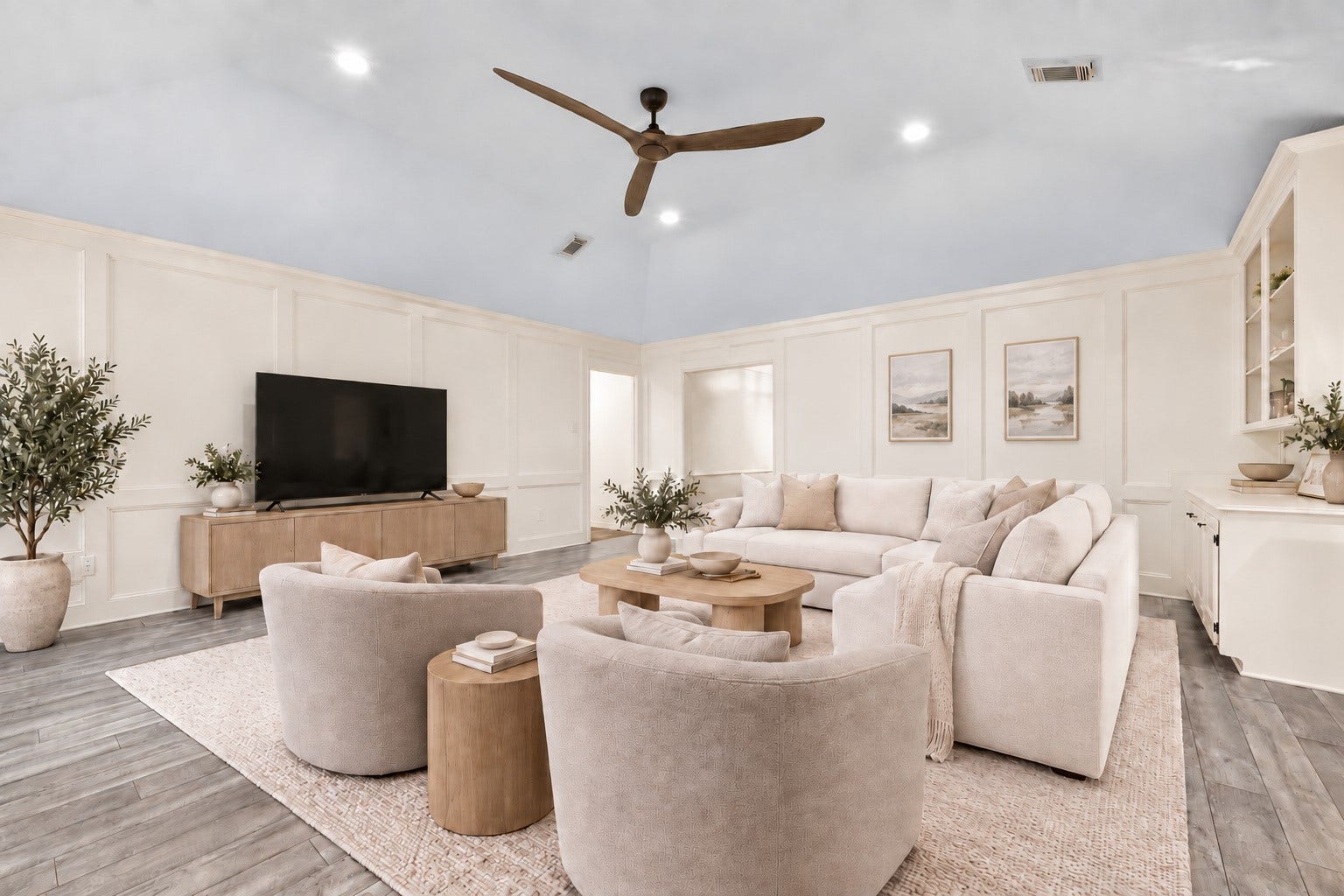 You'll love the family room... very spacious and offers beautiful wainscoting paneling along with a vaulted ceiling and recessed ceiling lighting. There's even a ceiling fan and a built in bookshelf as well! 
Virtually staged.