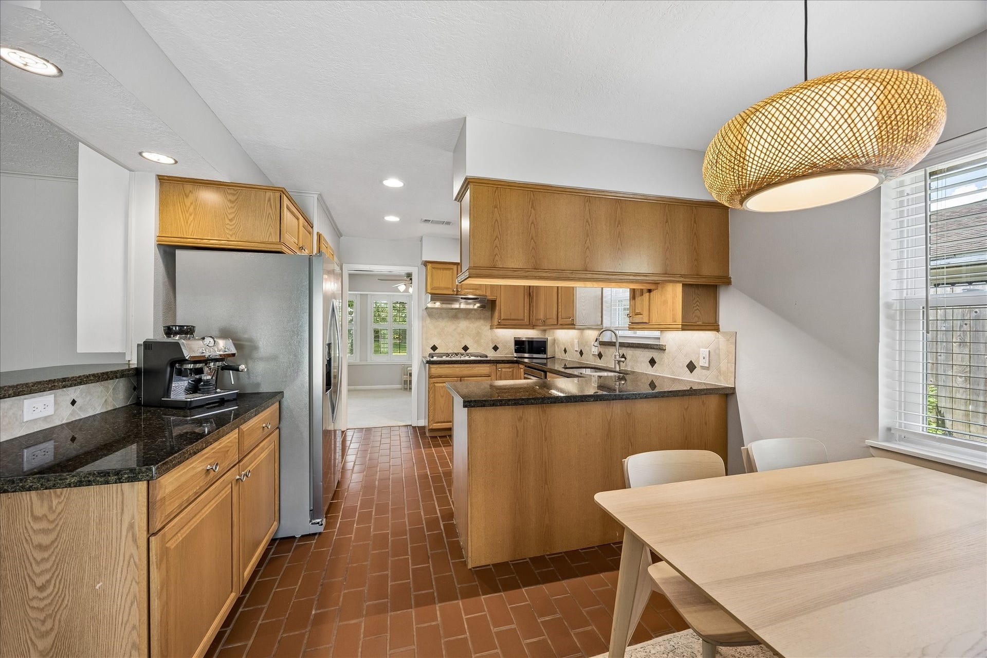 Kitchen has granite countertops, recessed lighting and soft-close drawers and cabinets.