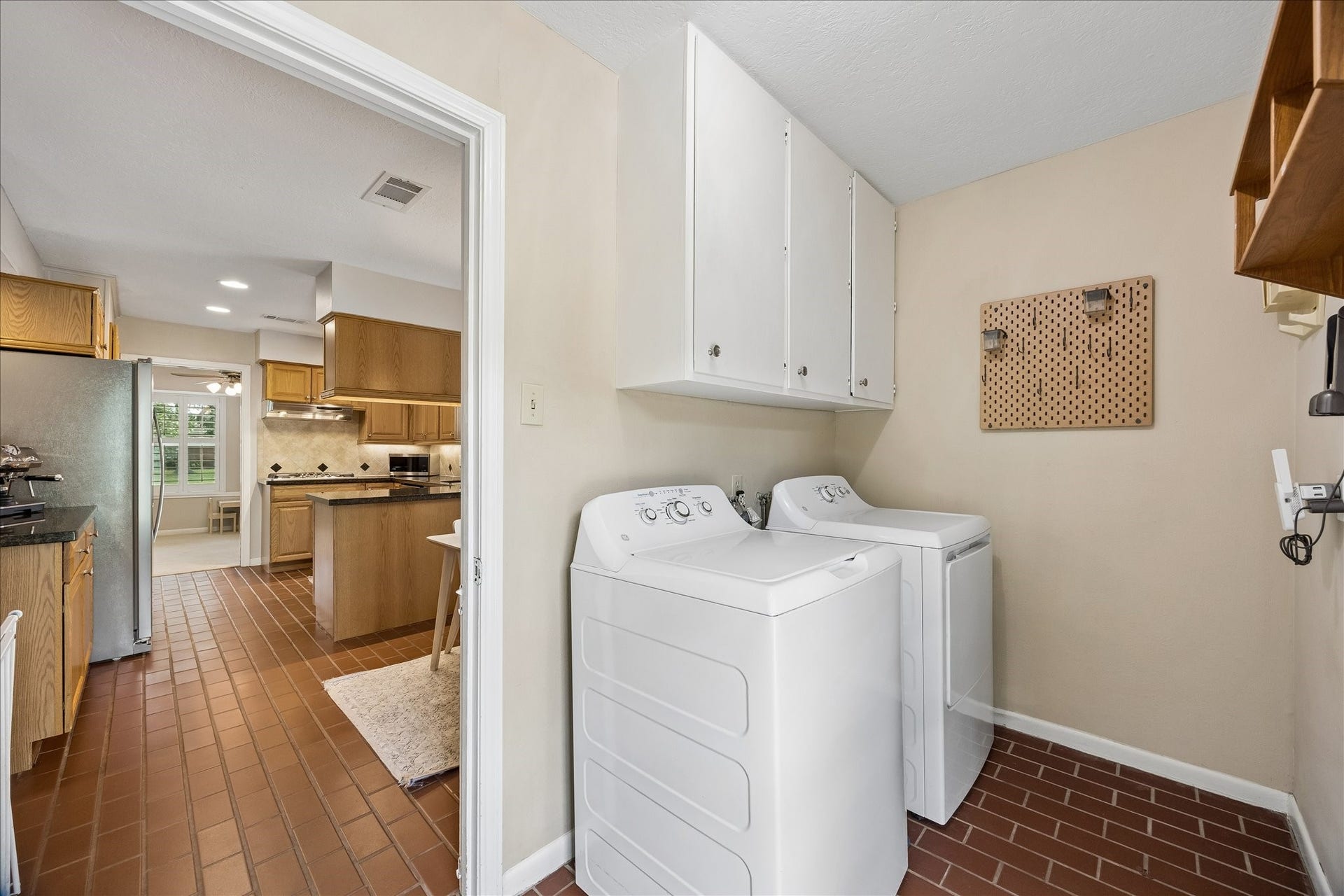 Large utility room is by the backdoor. Washer and Dryer stay with the home.