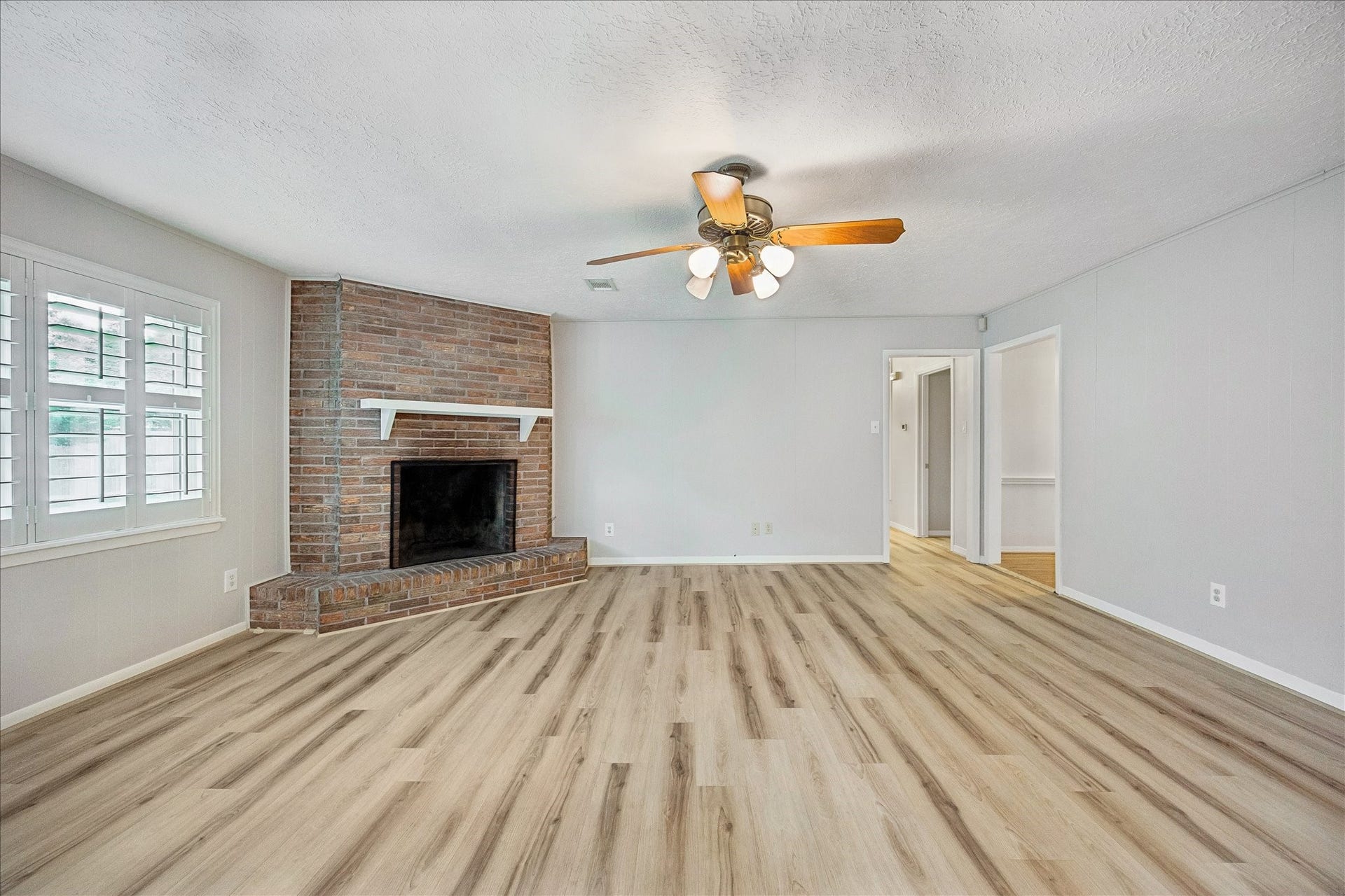 Updated floors and recent paint. Love all of the natural light!