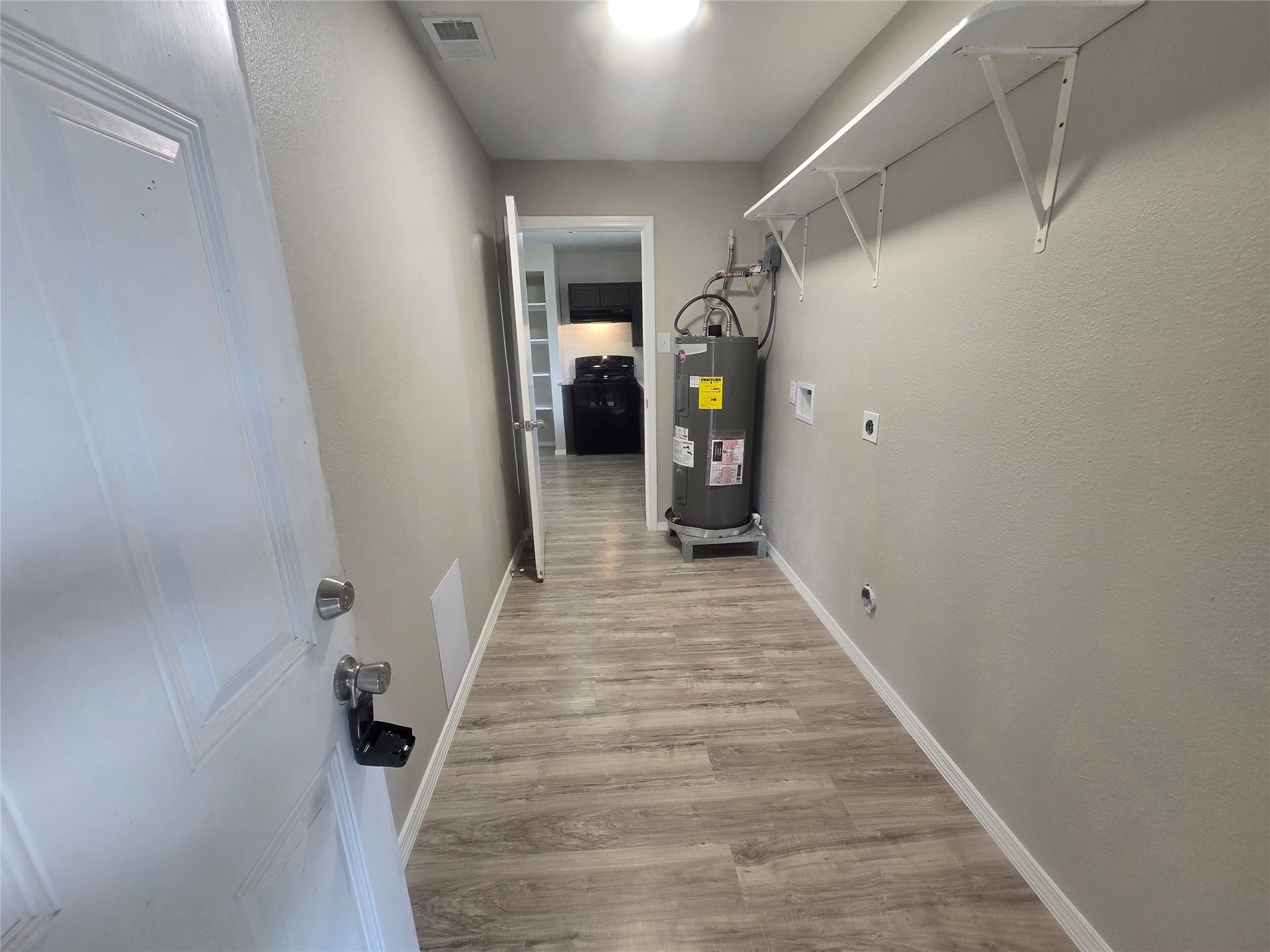 3453 W Highway 6, #1, Alvin, TX 77511 utility room with access from inside the house or from the carport