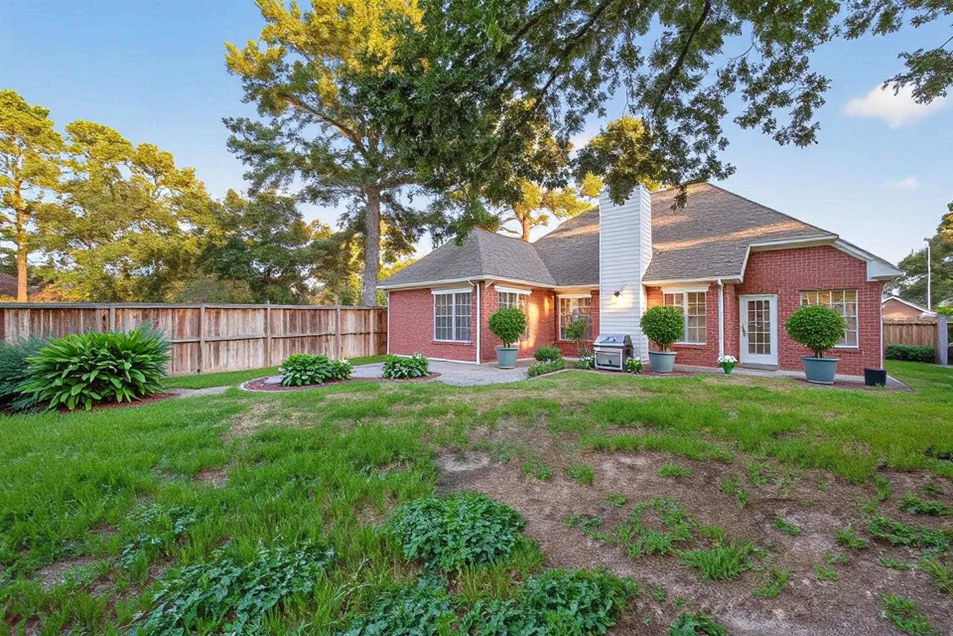 16002 Brittany Knoll Drive, Houston, TX 77095 This back yard has endless possibilities. The picture is virtually staged to show the beauty of adding greenery and a patio. A blank slate for you to design as you wish.