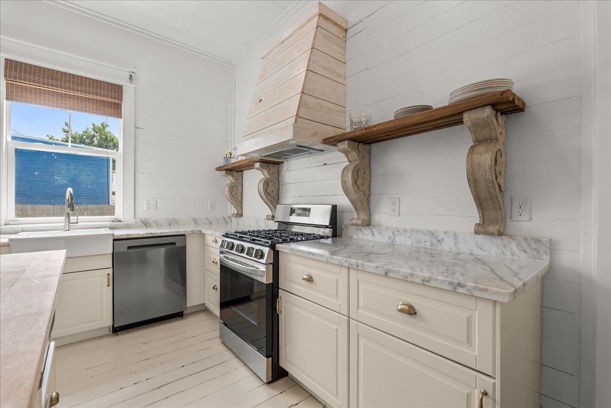 4201 Avenue R, Galveston, TX 77550 Kitchen detail with open shelving and updated finishes.