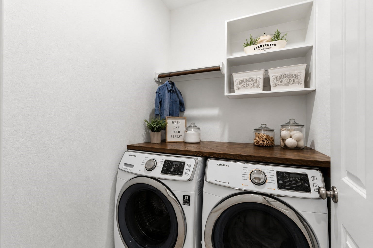 2143 Moss Creek Lane, Conroe, TX 77304 In-house laundry room features custom built-in shelving for added storage and organization.