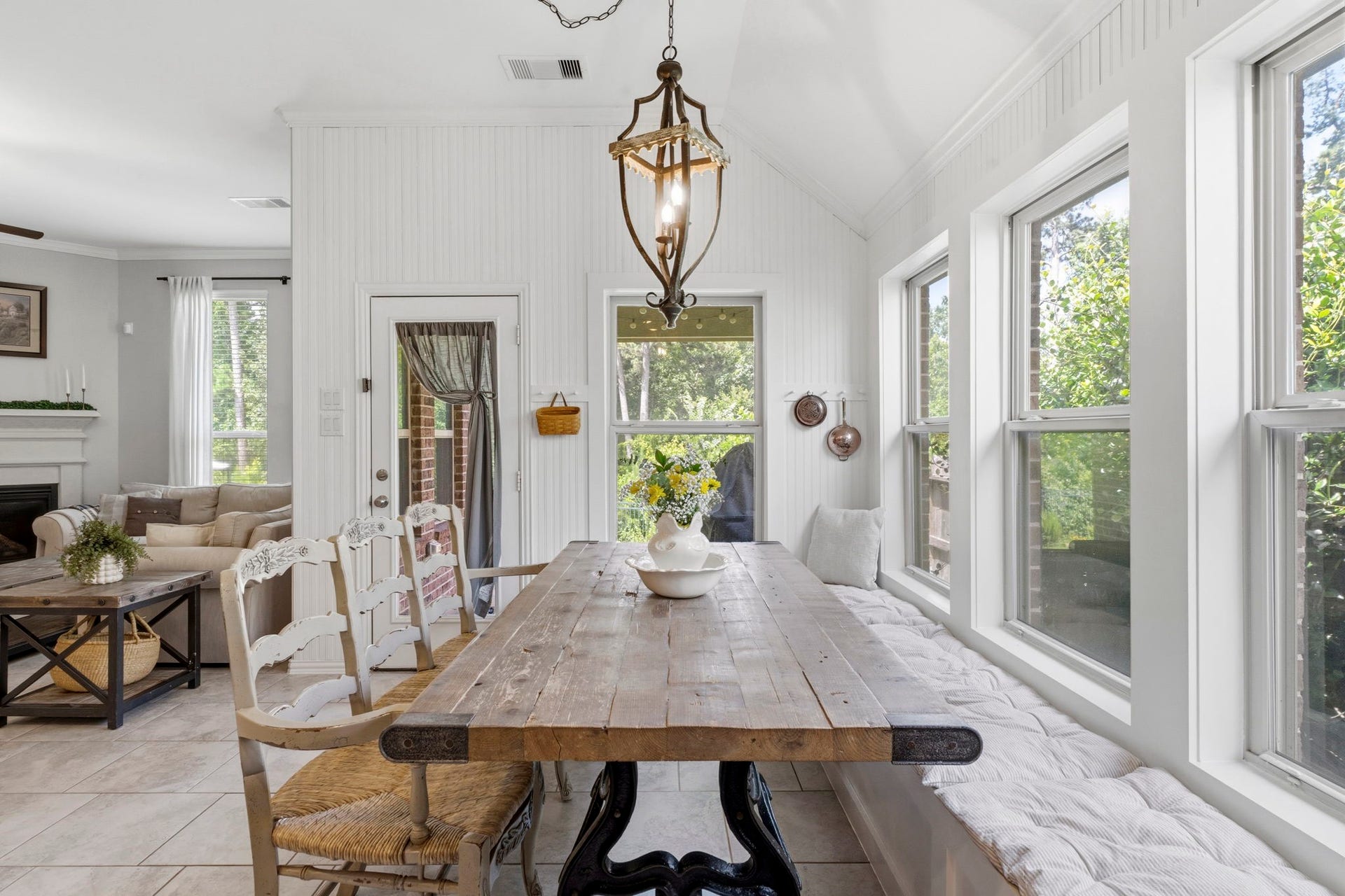 2143 Moss Creek Lane, Conroe, TX 77304 Custom built-in bench seating enhances the dining area, maximizing seating while providing tons of extra storage for everyday convenience. Custom beadboard accent wall adds timeless charm and architectural character to the space.