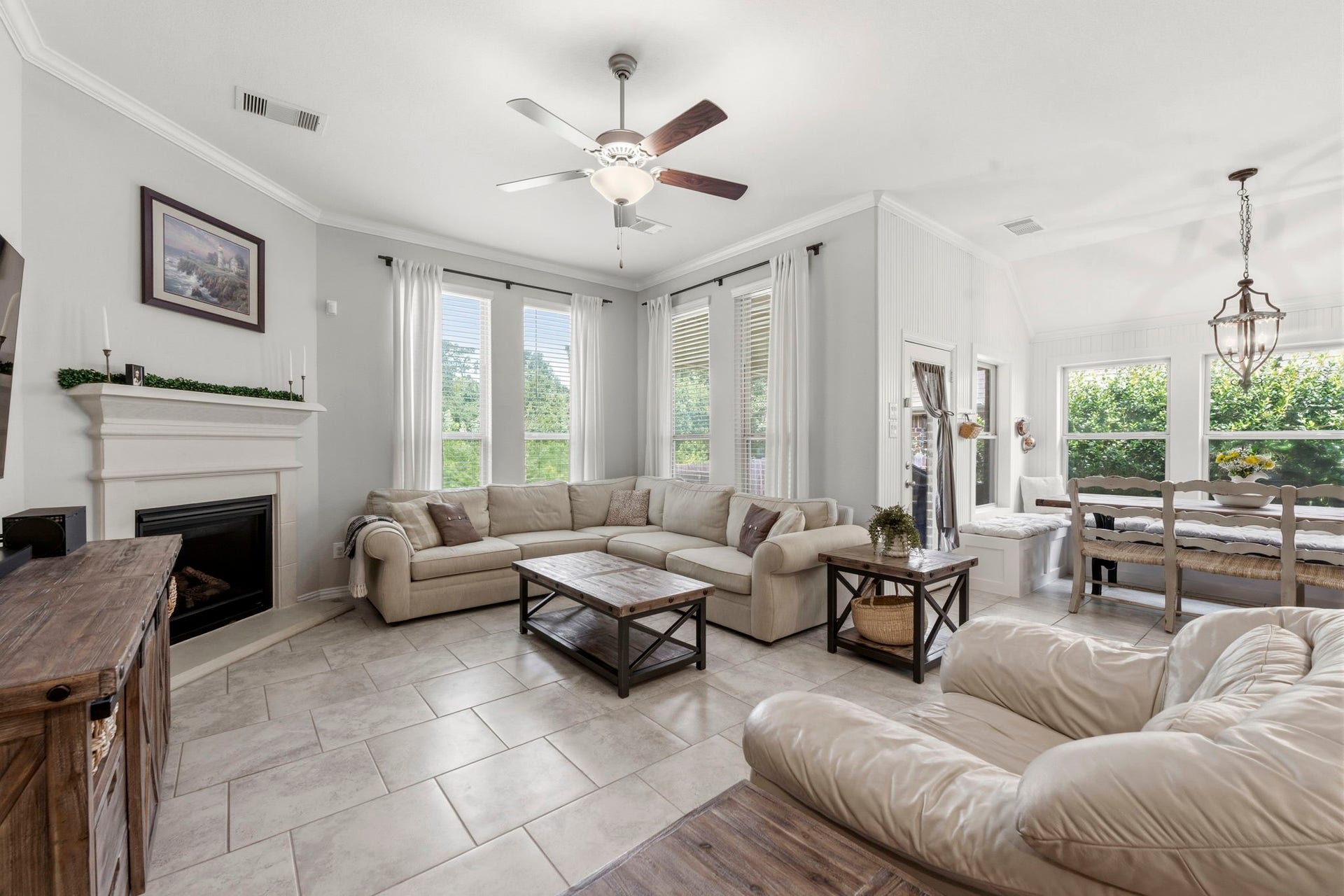 2143 Moss Creek Lane, Conroe, TX 77304 Open-concept living area flows seamlessly into the dining room and kitchen, while abundant natural light fills the space.
