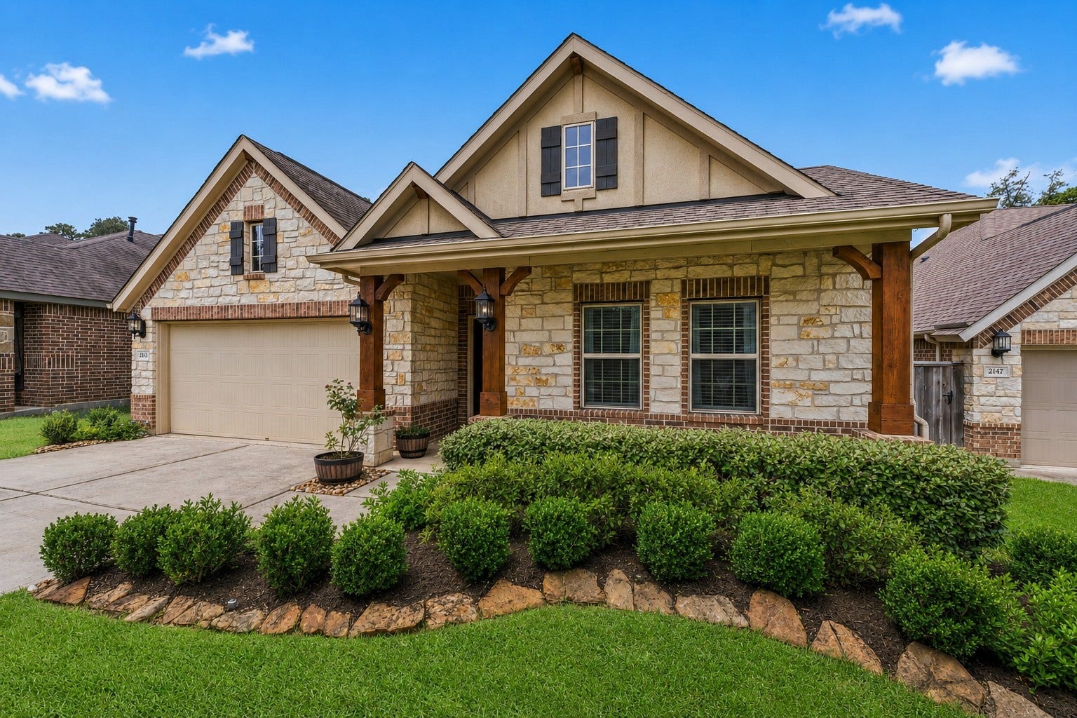 2143 Moss Creek Lane, Conroe, TX 77304 Welcome home to 2143 Moss Creek Lane! This beautiful home blends timeless stonework, warm wood details, and Craftsman charm.