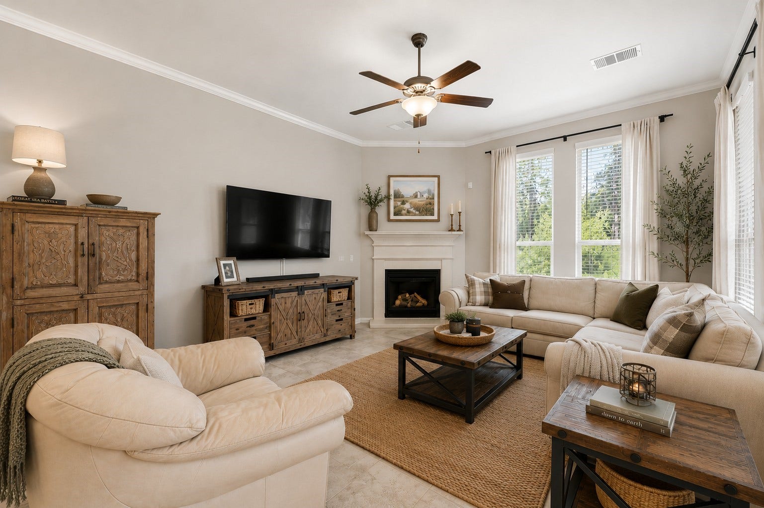 2143 Moss Creek Lane, Conroe, TX 77304 Light-filled living room featuring elevated ceilings, crown molding, a cozy fireplace, and a wall of windows overlooking the backyard. *VIRTUALLY STAGED*