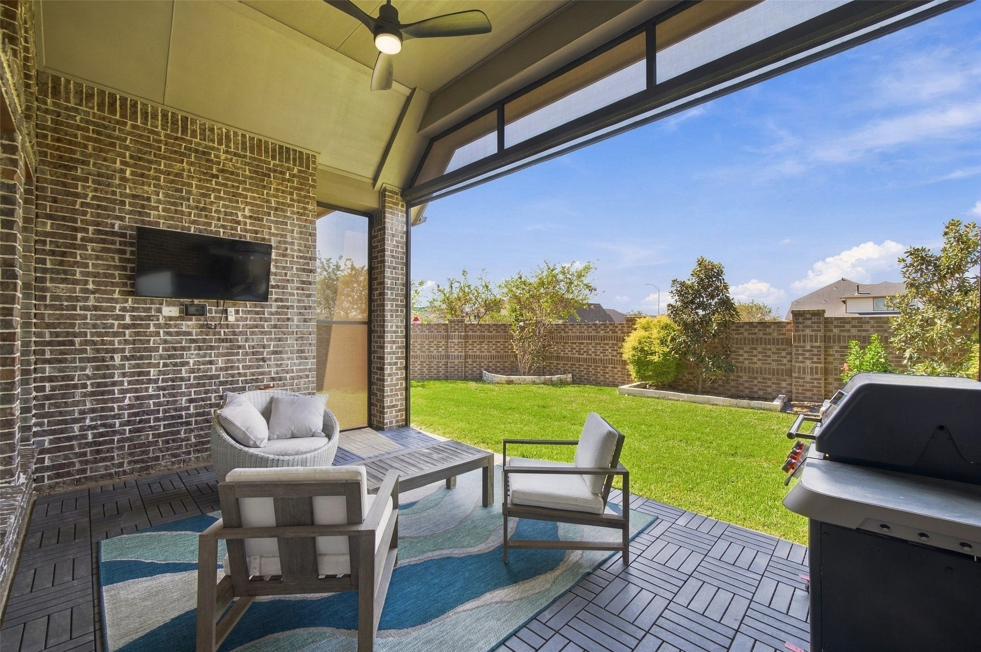 20503 Star Stable Lane, Tomball, TX 77377 This back patio features remotes controlled sun shades which provide a screened in patio which means you can enjoy this all year round!!