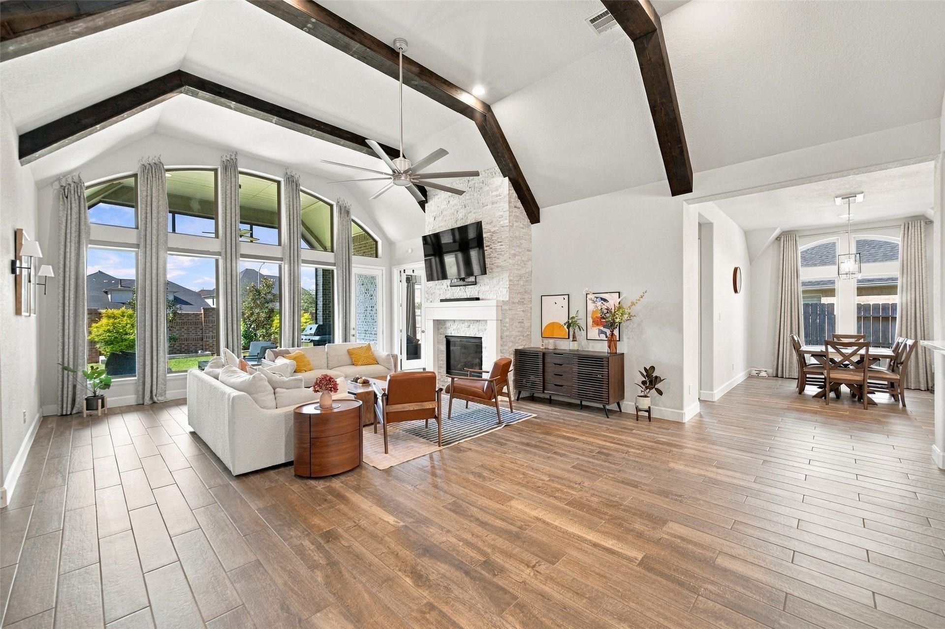 20503 Star Stable Lane, Tomball, TX 77377 Lots of natural light pour into this room with the beautiful custom beams and stone fireplace! remote control shades complete the windows!