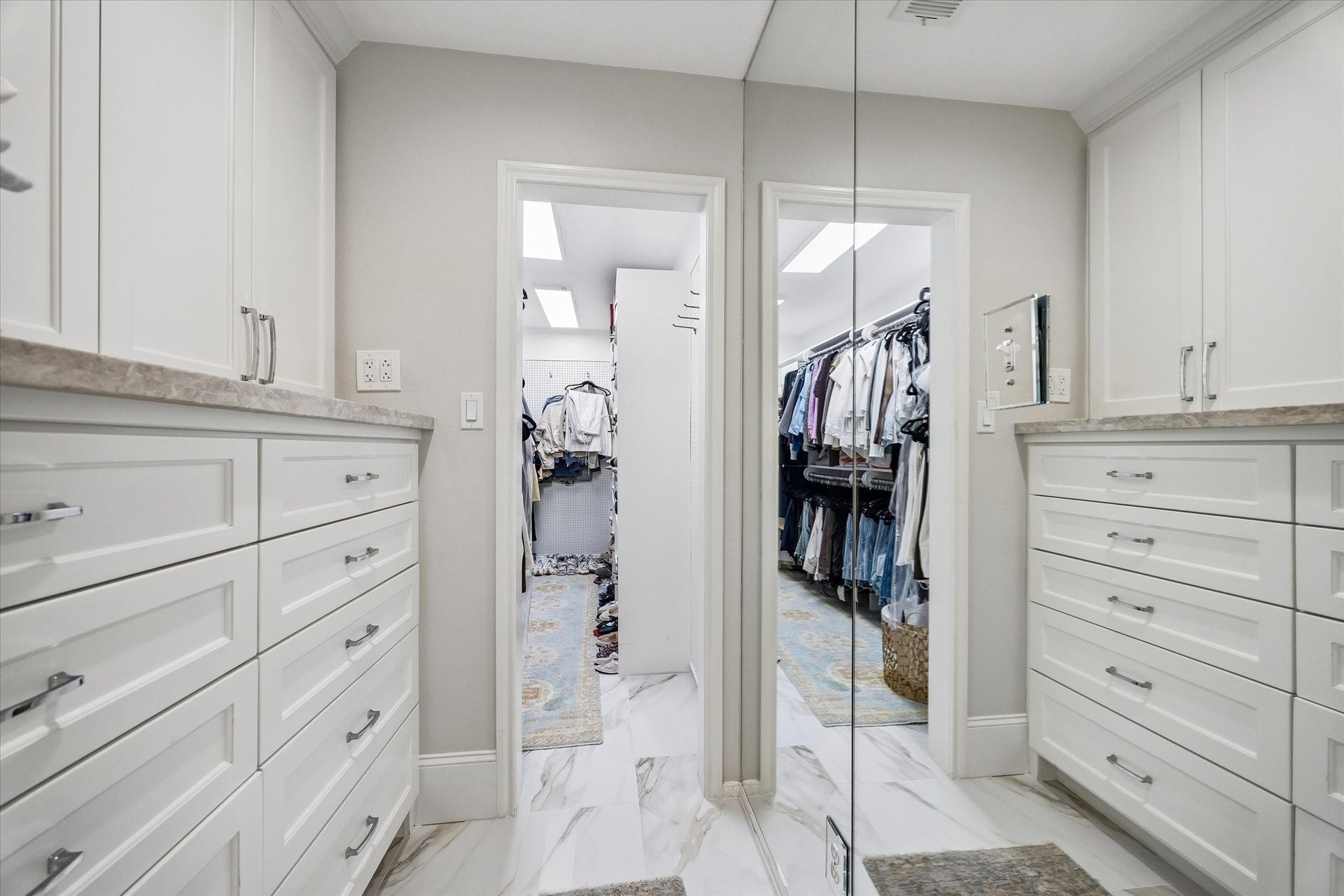 2555 Bering Drive, #11, Houston, TX 77057 Fully new built-out primary closet does not disappoint; features custom shelving and ample storage space designed to maximize organization.