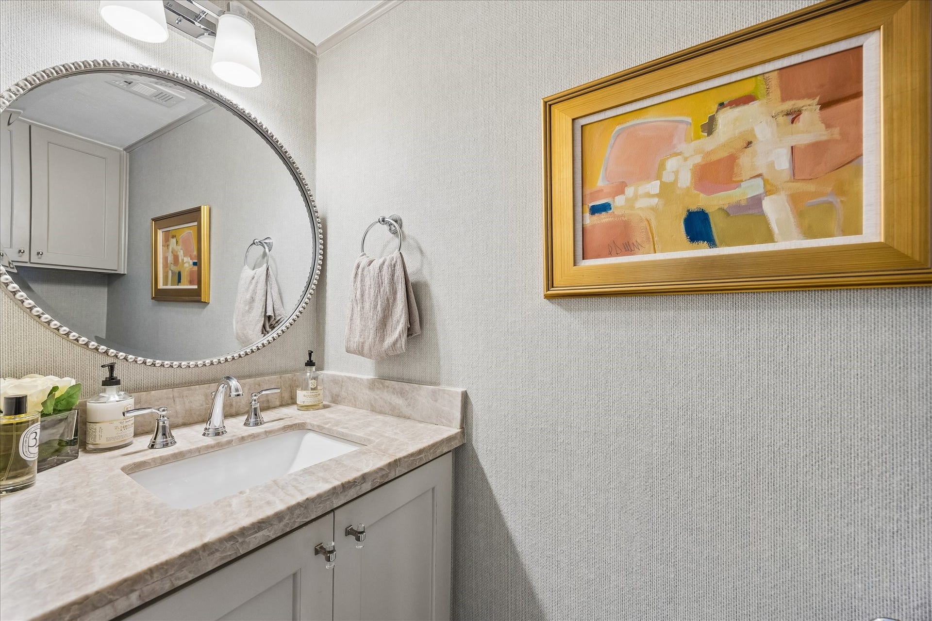 2555 Bering Drive, #11, Houston, TX 77057 Fully remodeled powder bath located on the first floor complete with natural stone quartzite counters, marble mosaic floors, decorative mirror and light fixture included.