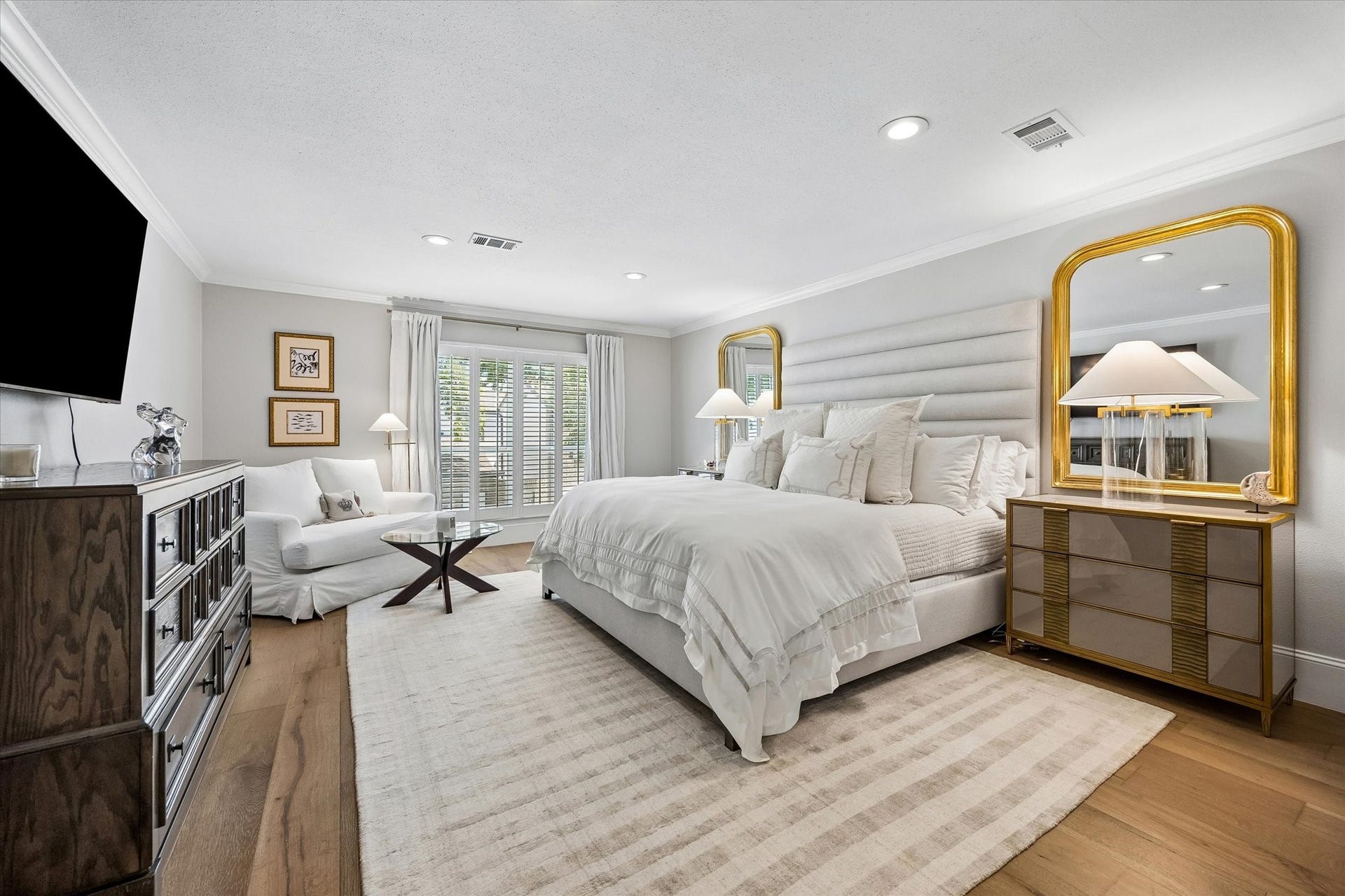 2555 Bering Drive, #11, Houston, TX 77057 Stunning primary suite located on the second floor featuring beautiful white oak flooring that flows throughout the space, creating a serene and sophisticated retreat.