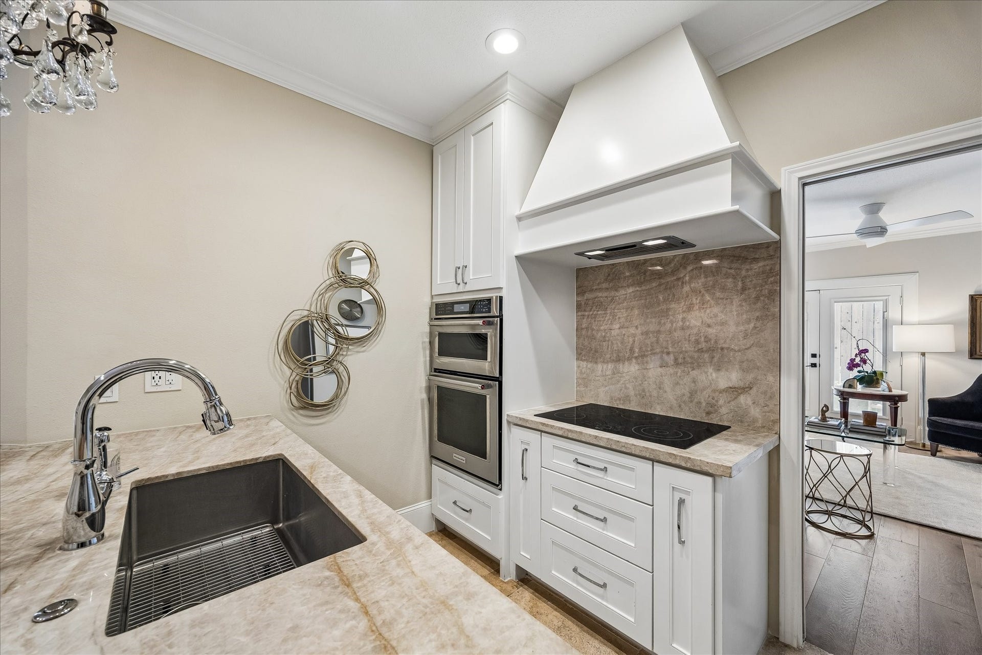 2555 Bering Drive, #11, Houston, TX 77057 This kitchen has been fully remodeled and features new KitchenAid appliances, quartzite natural stone countertops and backsplash, custom cabinetry and a modern Delta faucet.