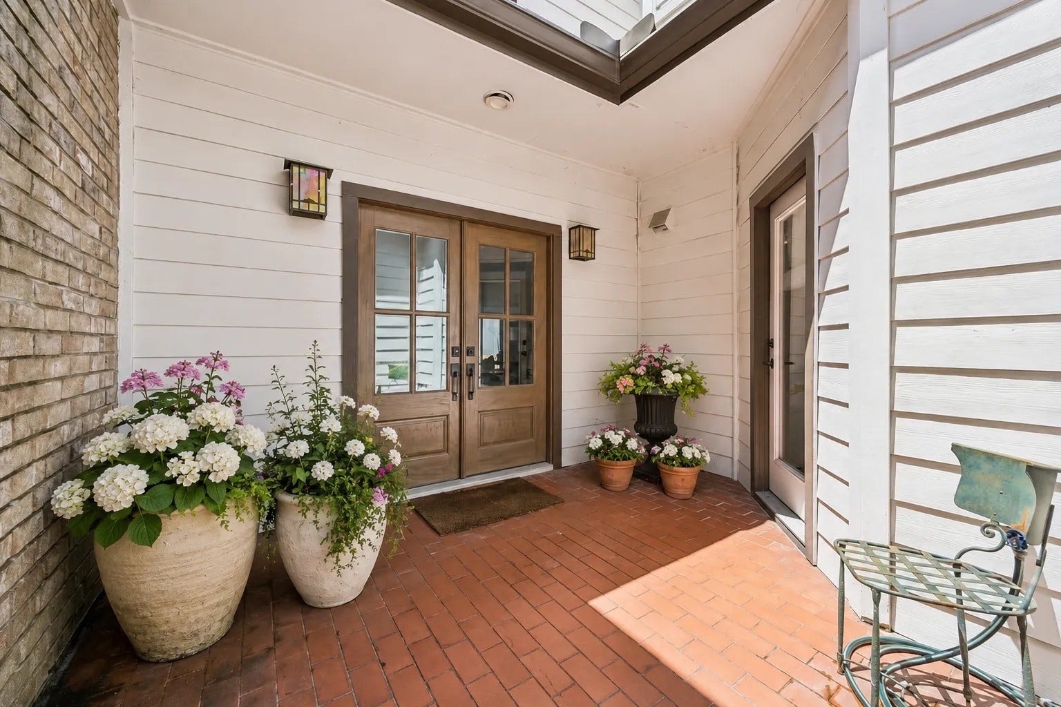 2555 Bering Drive, #11, Houston, TX 77057 Elegant French doors welcome guests and establish the sophisticated tone of the home.
