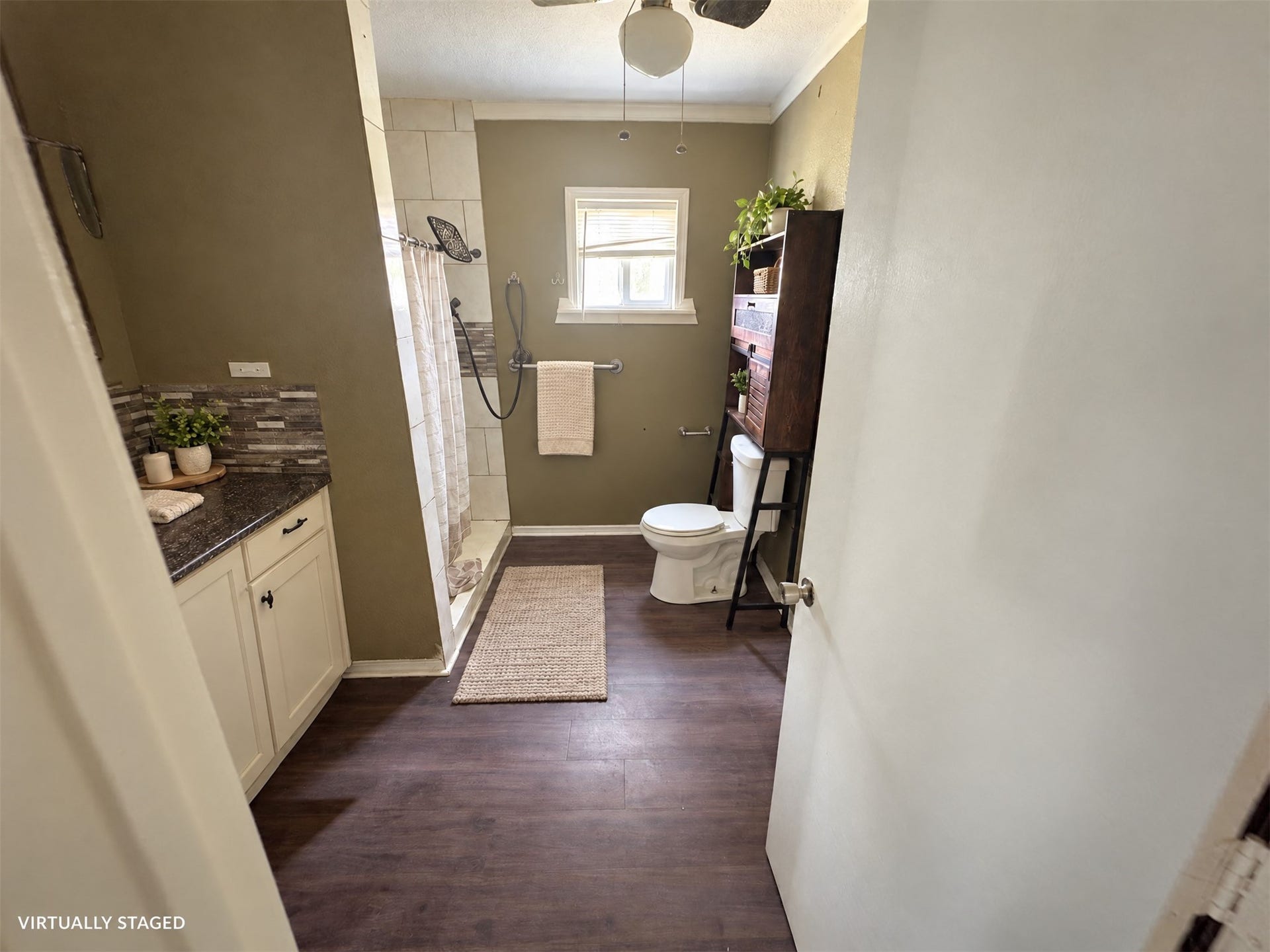 113 N Pecan Drive, Texas City, TX 77591 Virtually staged: towels and restrained accessories soften this existing bathroom.