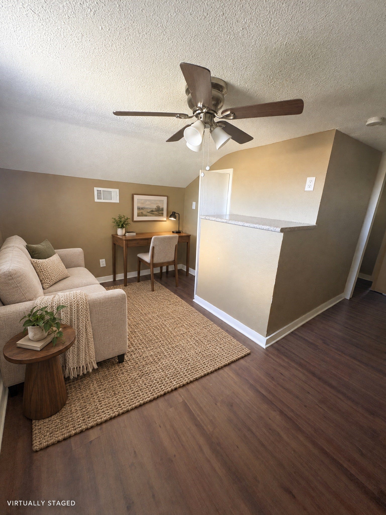 113 N Pecan Drive, Texas City, TX 77591 Virtually staged: a compact sitting and work area illustrates one use of the upper-level space.