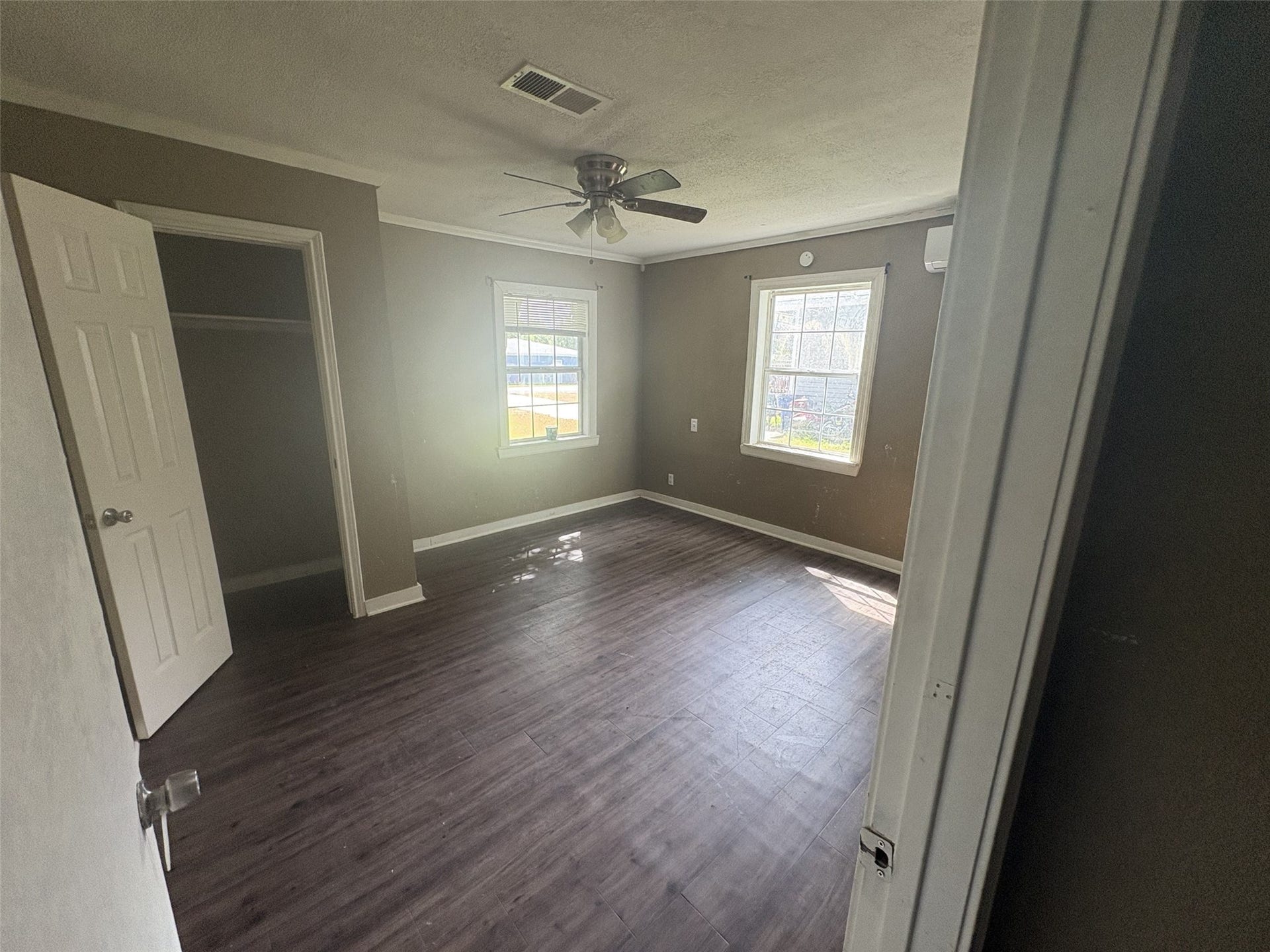113 N Pecan Drive, Texas City, TX 77591 Two windows and an open closet bring light and storage to this room.
