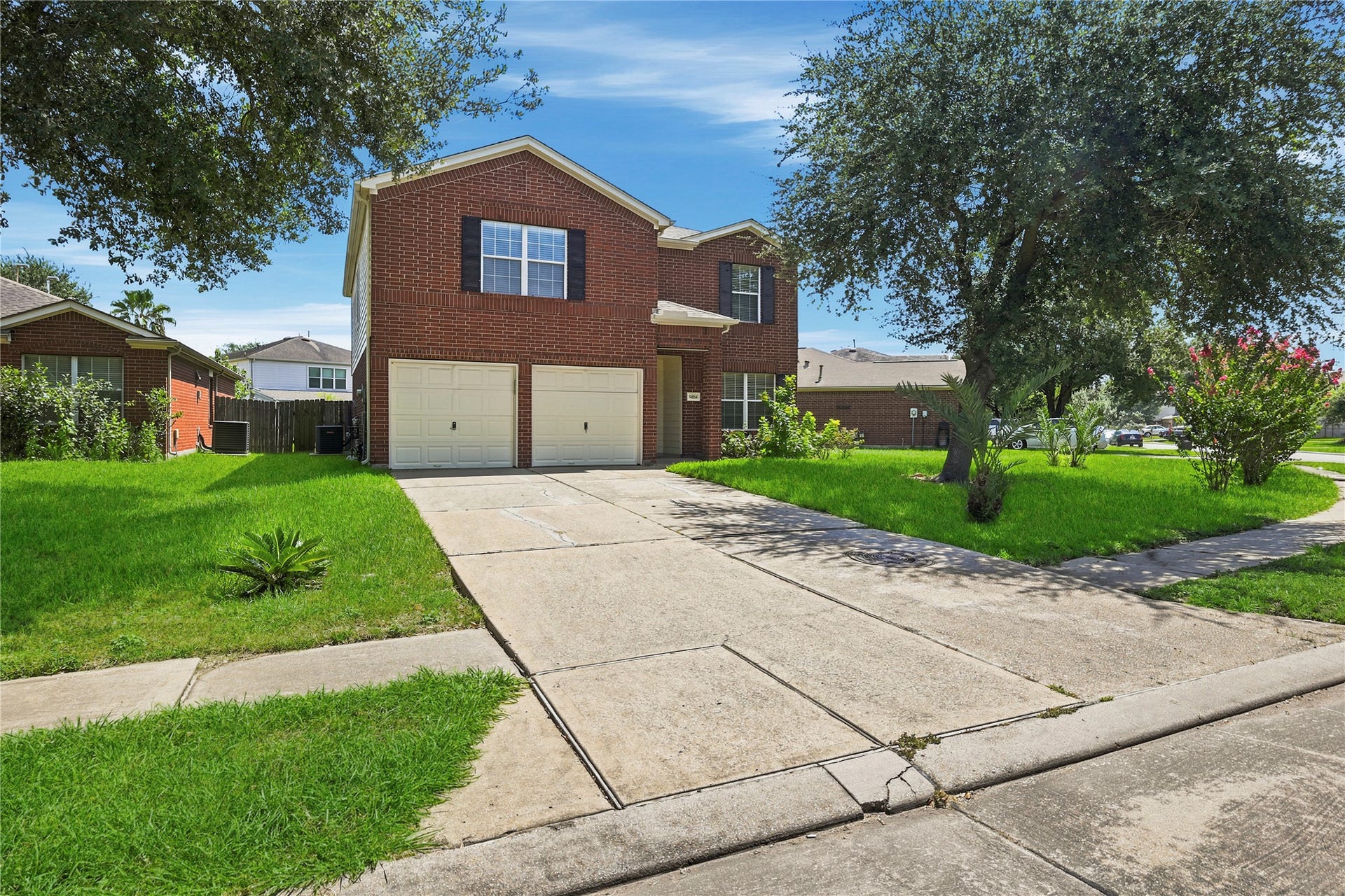 14954 Sugar Sands Drive, Sugar Land, TX 77498 Welcome to 14954 Sugar Sands Drive, a charming two-story brick home featuring a spacious front yard, mature shade trees, and a two-car attached garage in the desirable Sugar Grove community.