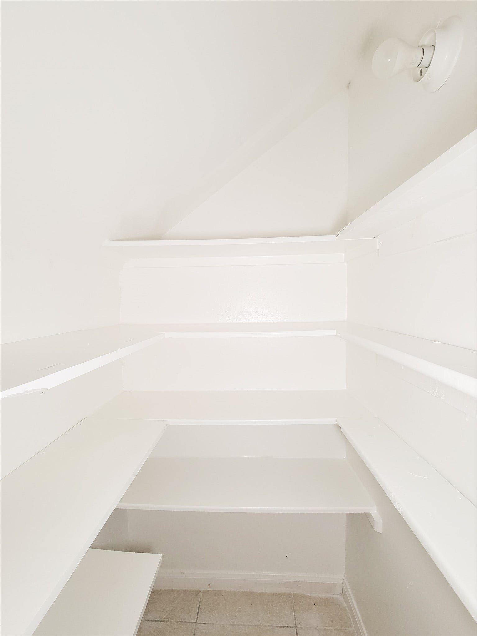 3005 La Estancia Lane, Houston, TX 77093 Spacious walk-in pantry with ample shelving and a clean, bright design, perfect for organized storage.