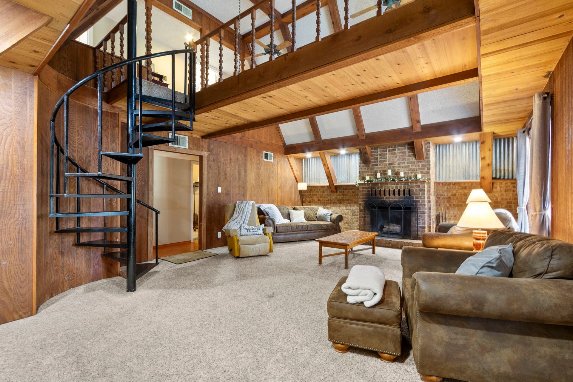 A staircase that makes a statement.
The eye-catching spiral staircase becomes a beautiful centerpiece, leading to two generously sized bedrooms, a full bathroom, and plenty of convenient storage space.