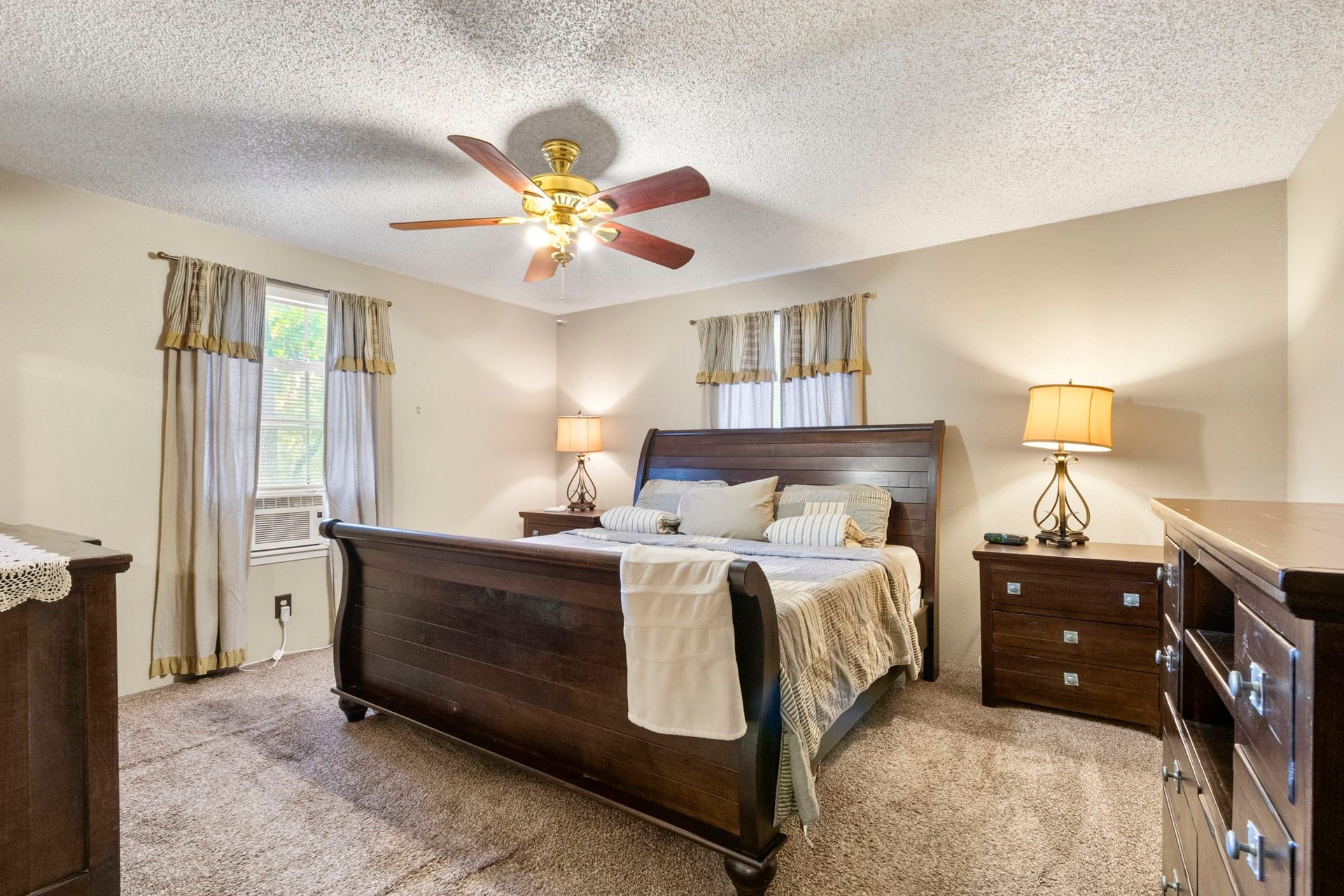 First-floor primary bedroom for added convenience.
The home features central HVAC, plus an additional window unit in the primary bedroom because the sellers enjoy keeping their space extra cool and comfortable.