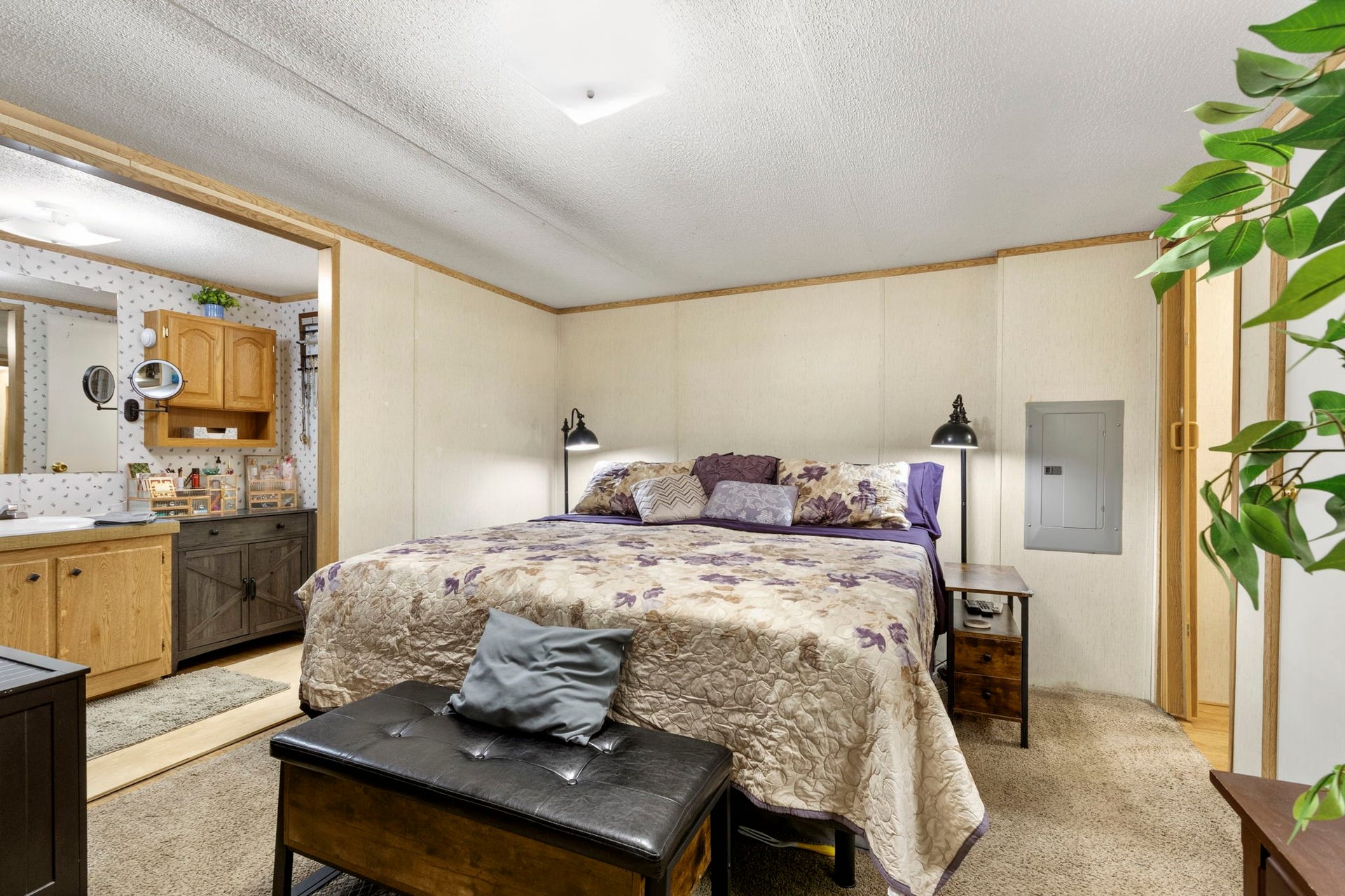 The second home offers two bedrooms, two bathrooms, a private septic system, and a shared well with the main home.